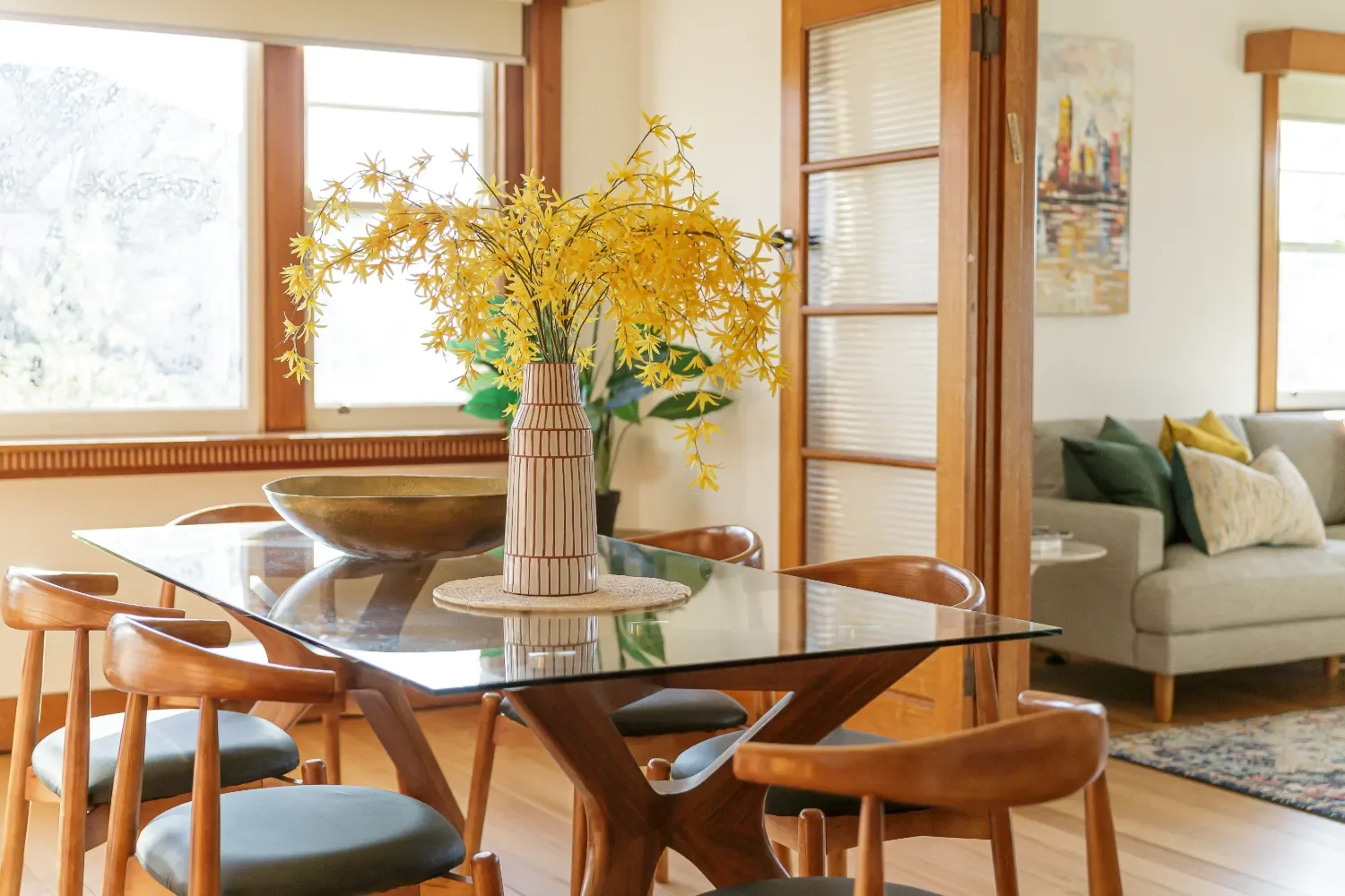 Fresh flowers in a vase on a glass table