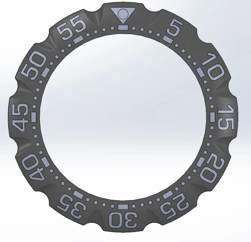 A circular, rotating bezel with numbered markings from 0 to 55, used for diving watches.