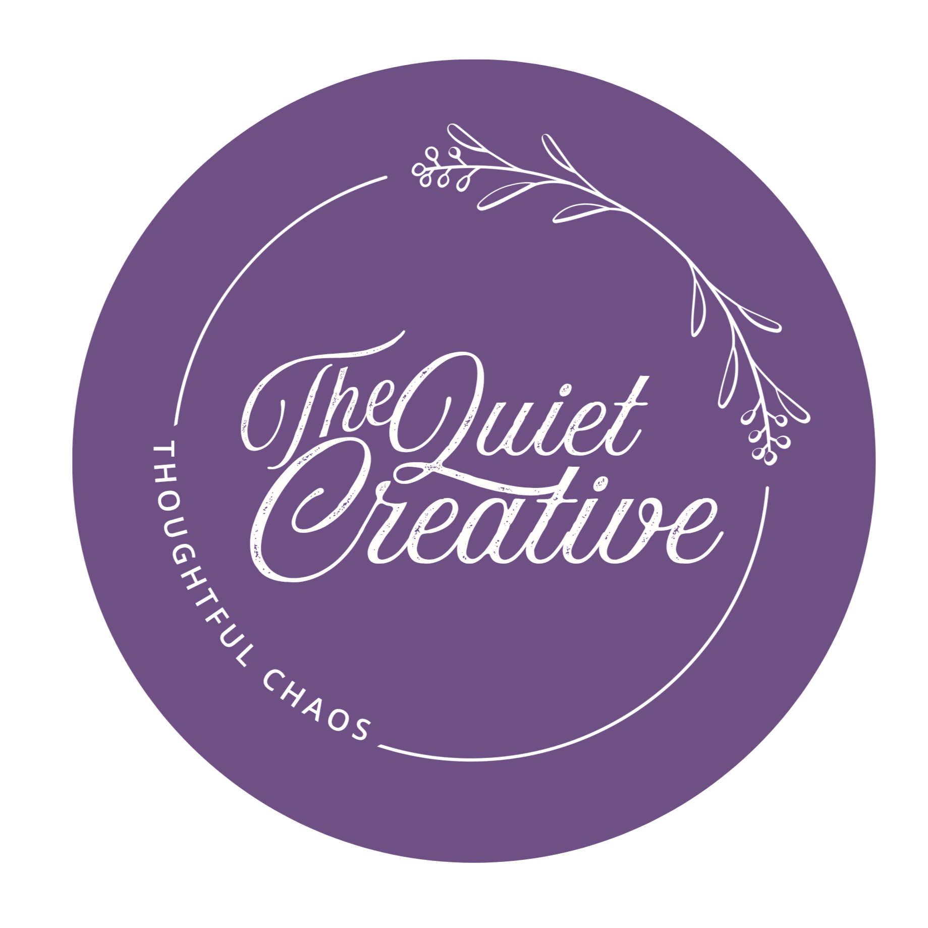 Close-up of a circular purple badge with white handwritten-style text that reads "The Quiet Creative." The badge has decorative white floral line drawings at the top and a border of white text around the edge that says "Thoughtful, Beautiful, Charming."