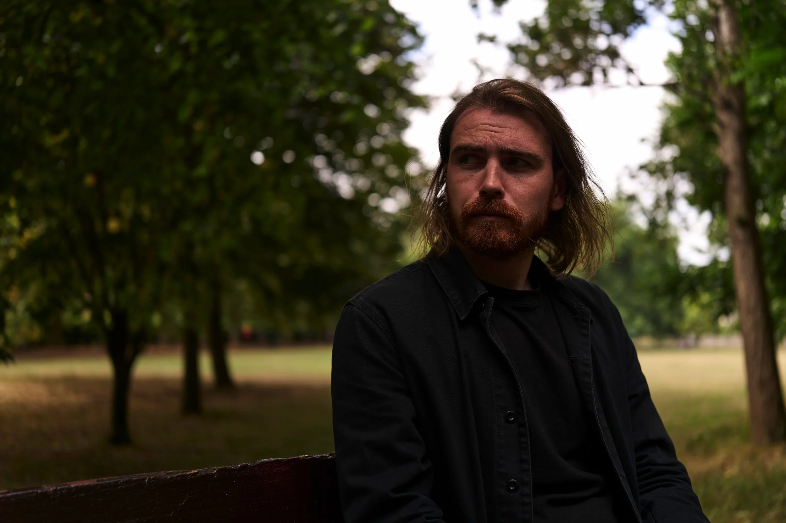 (c) Laurence Cummins Photography - English specialist medium format wedding & portrait photography based in Somerset UK, covering all of England - A timeless elegant portrait of a man / male sat on a bench looking regal