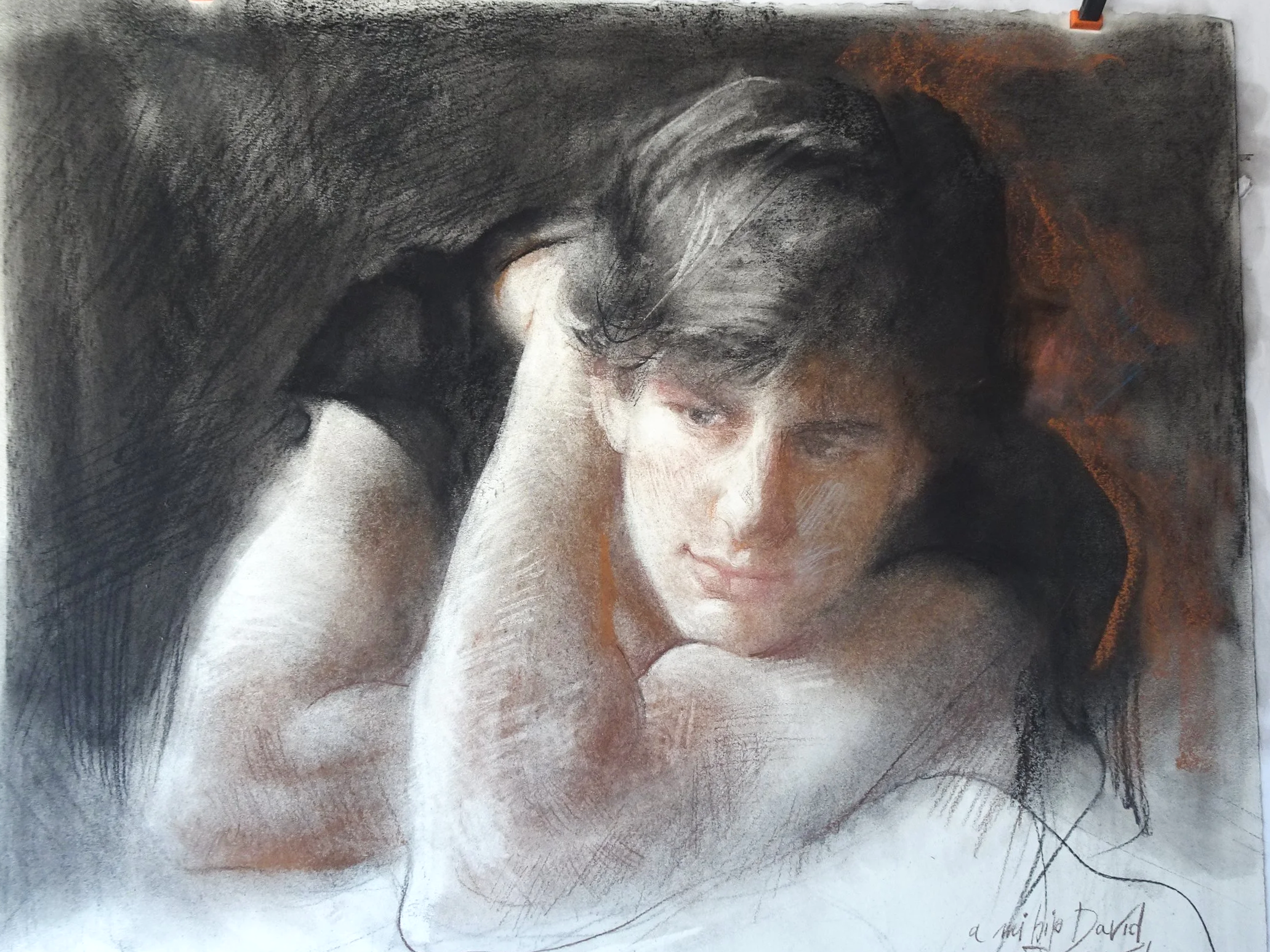 Drawing of a woman with dark hair, resting her head on her hand, created with charcoal and white chalk, with a dark background.