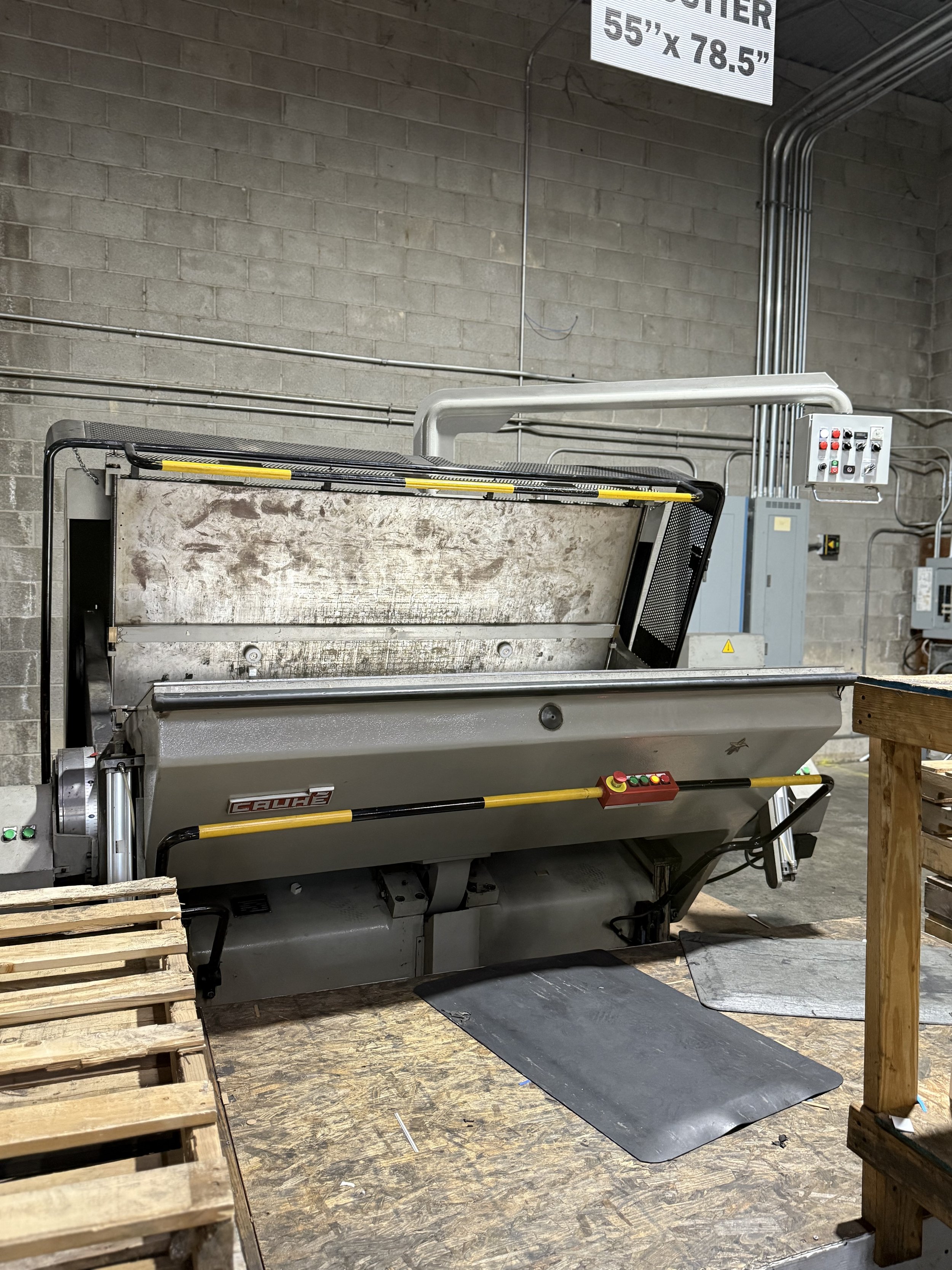 Industrial machine in a warehouse with control panel, Flat die cutter, tooling