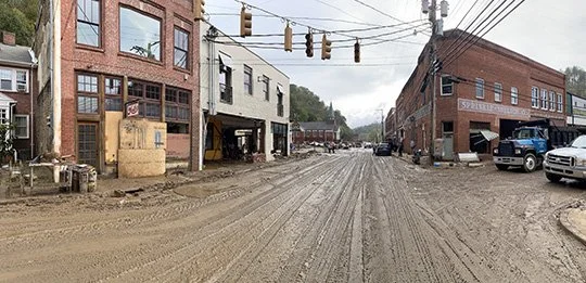 Mal's Bar is across from the now absent Post Office. The large county building on the right will not be reopening.