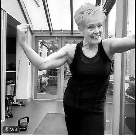 woman doing online workout with personal trainer in coventry her home
