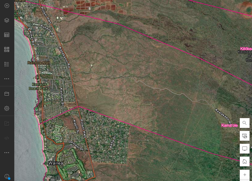 Satellite map showing a coastal area with neighborhoods, parks, and roads on the left side, and a large undeveloped or natural green and brown area on the right, with pink boundary lines.