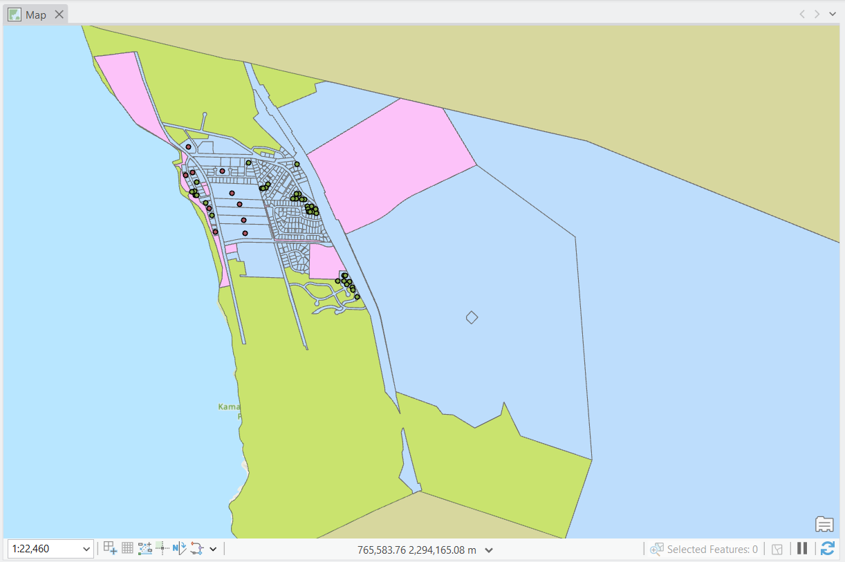 A detailed map of a coastal area showing land parcels, roads, and water bodies with various color-coded regions, including residential, commercial, and green spaces.