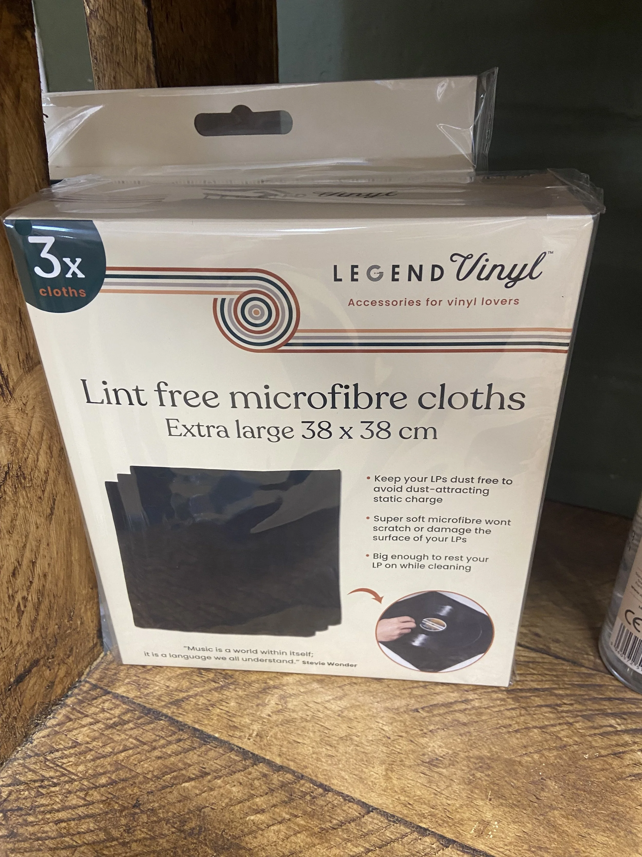 Box of three extra large lint-free microfibre cloths for vinyl records, size 38x38 cm, in retail packaging on a wooden surface.