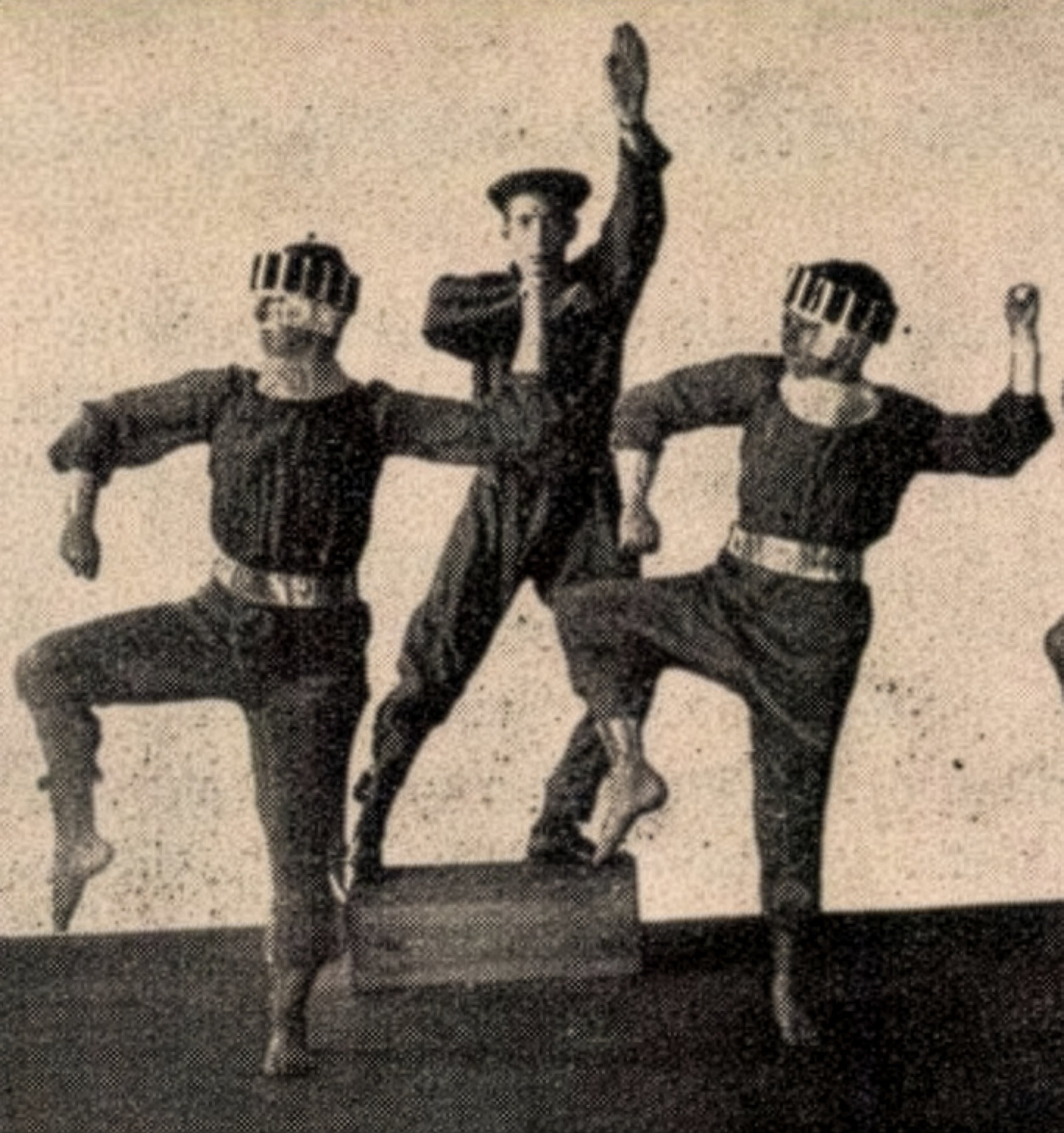 Black-and-white photograph of five performers posing for the cogwheel scene from Dance of the Machines.
