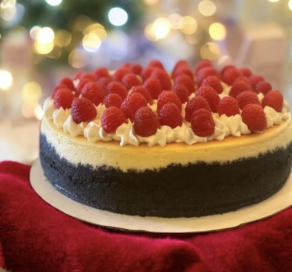 Cheesecake with Whipped Cream and Raspberries