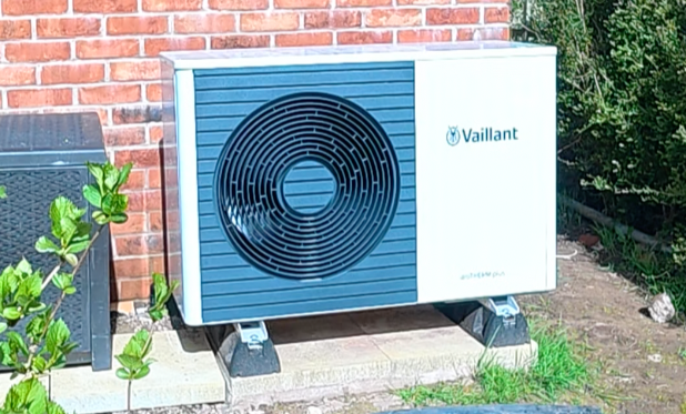 ASHP installed in a garden of a property