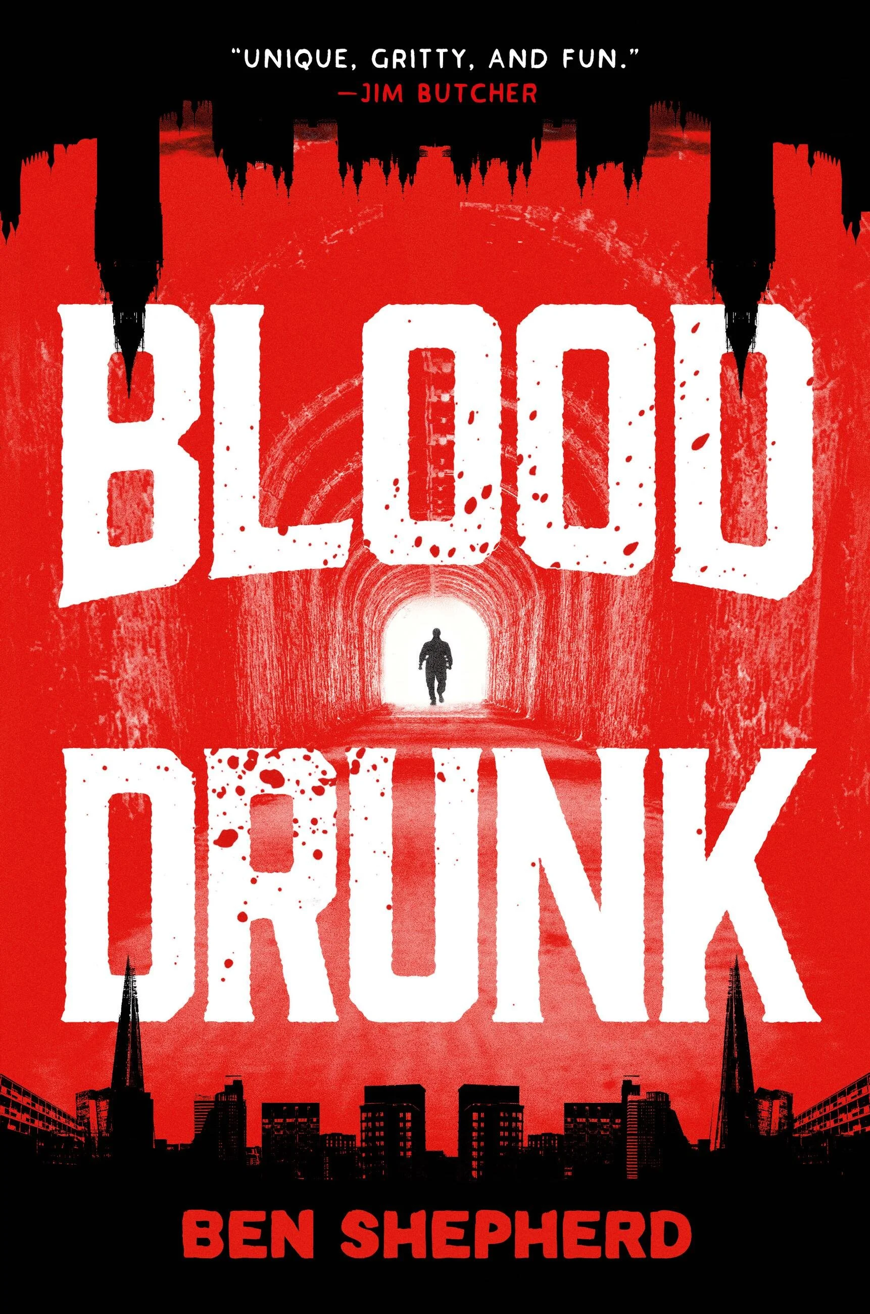 Cover of the book titled 'Blood City' by Ben Shepherd, featuring a red cityscape with a silhouette of a man walking through an archway, and the quote 'Unique, gritty, and fun' by Jim Butcher at the top.