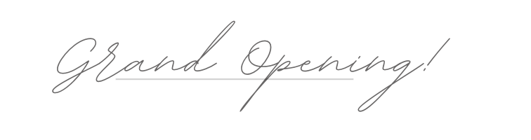 Elegant handwritten text that says 'Grand Opening!'