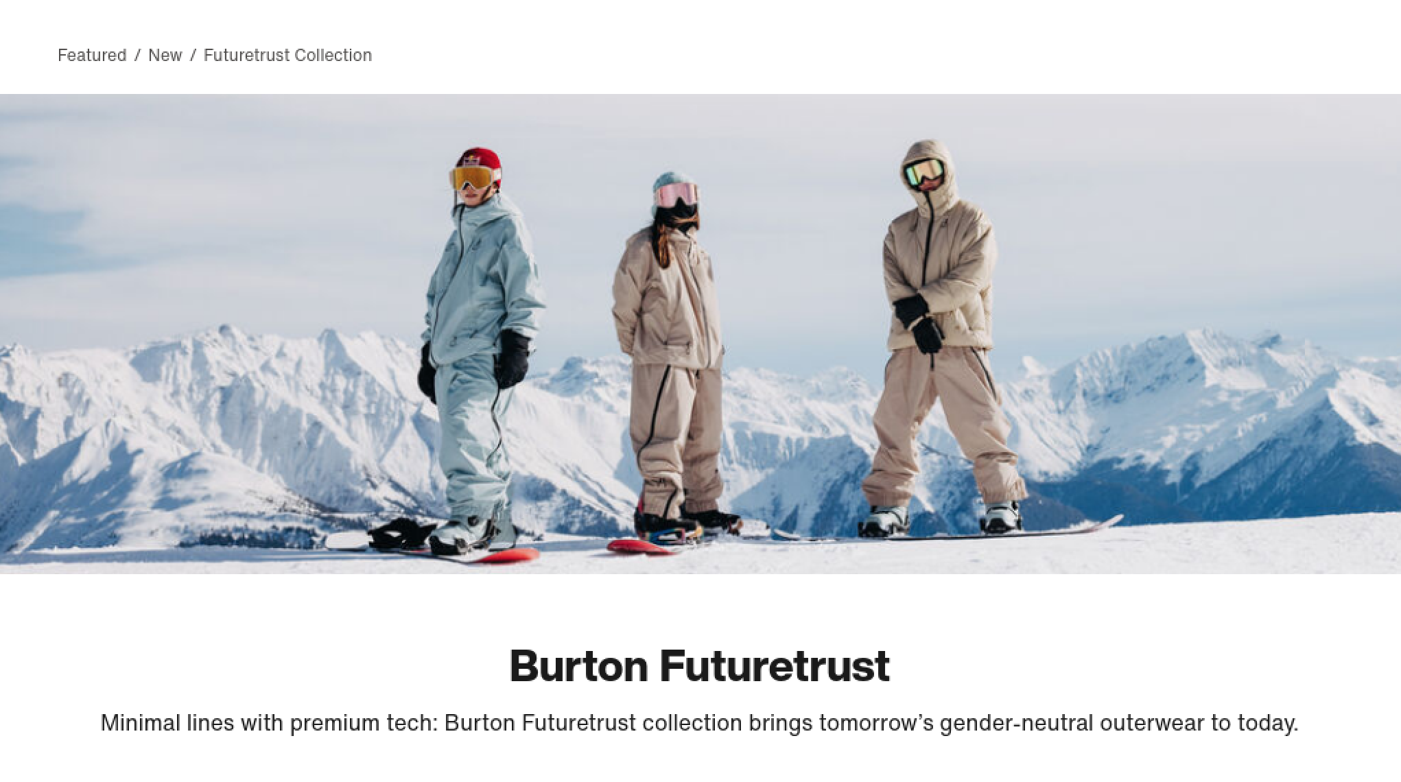Three people in winter gear, wearing ski masks and goggles, standing on snow-covered ground with snow-covered mountains in the background.