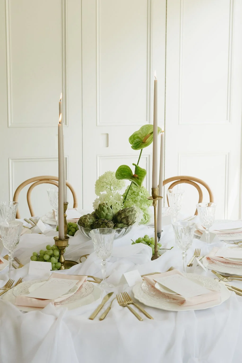 Airy tablescape with artichokes and taper candles