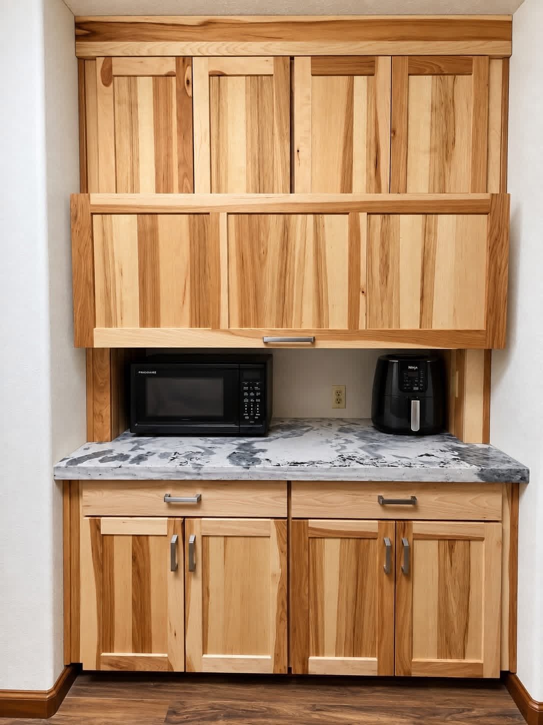Beautiful natural hickory cabinets, with a hidden area for appliances, installed by NW Home Innovations