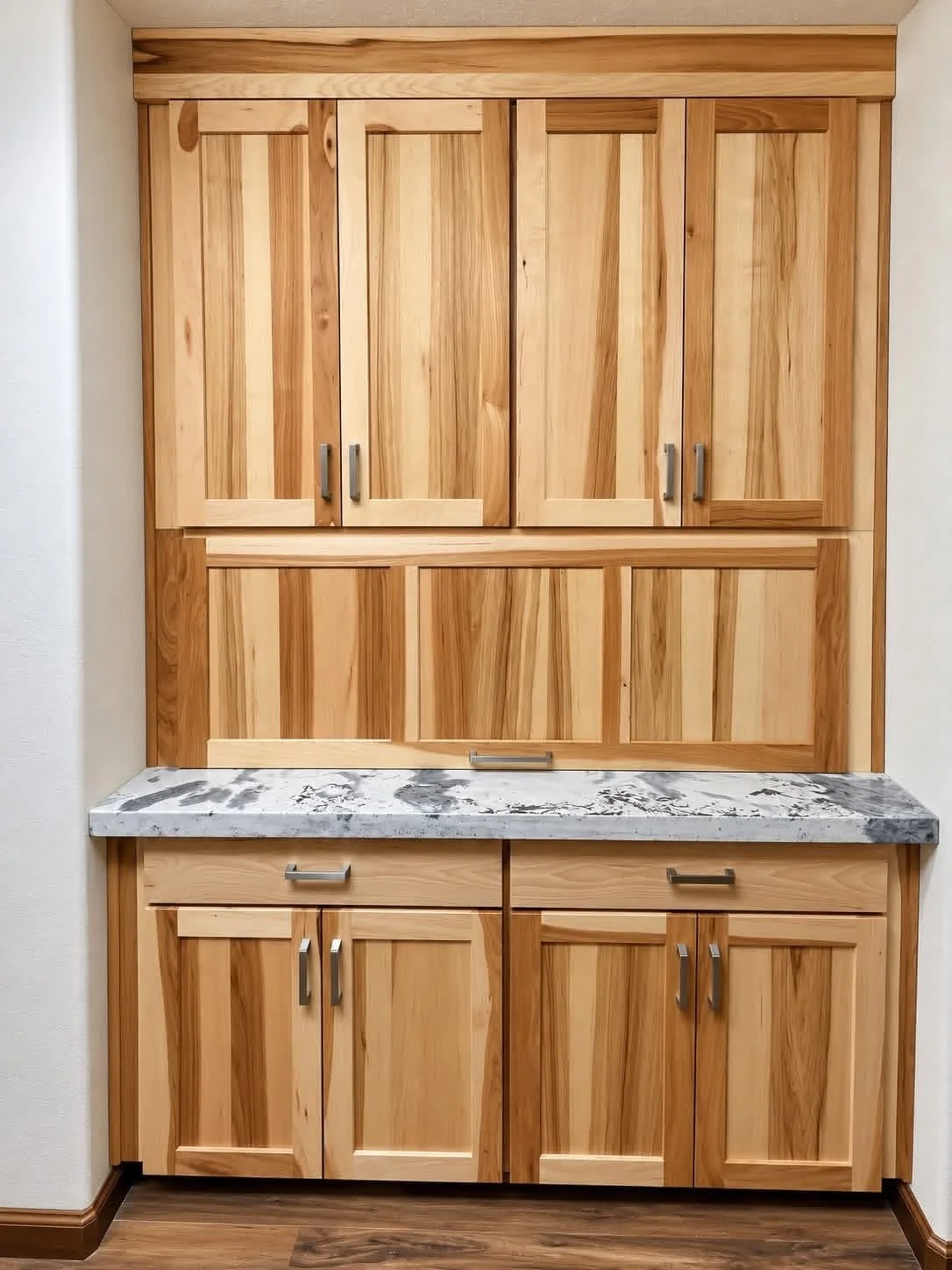 A kitchen with wooden cabinets, stainless steel appliances, a granite countertop with brown, black, and gold patterns, a gas stove, a microwave, a refrigerator, and a small blackboard on the wall near large windows with white trim. The walls are painted red, and there is hardwood flooring.