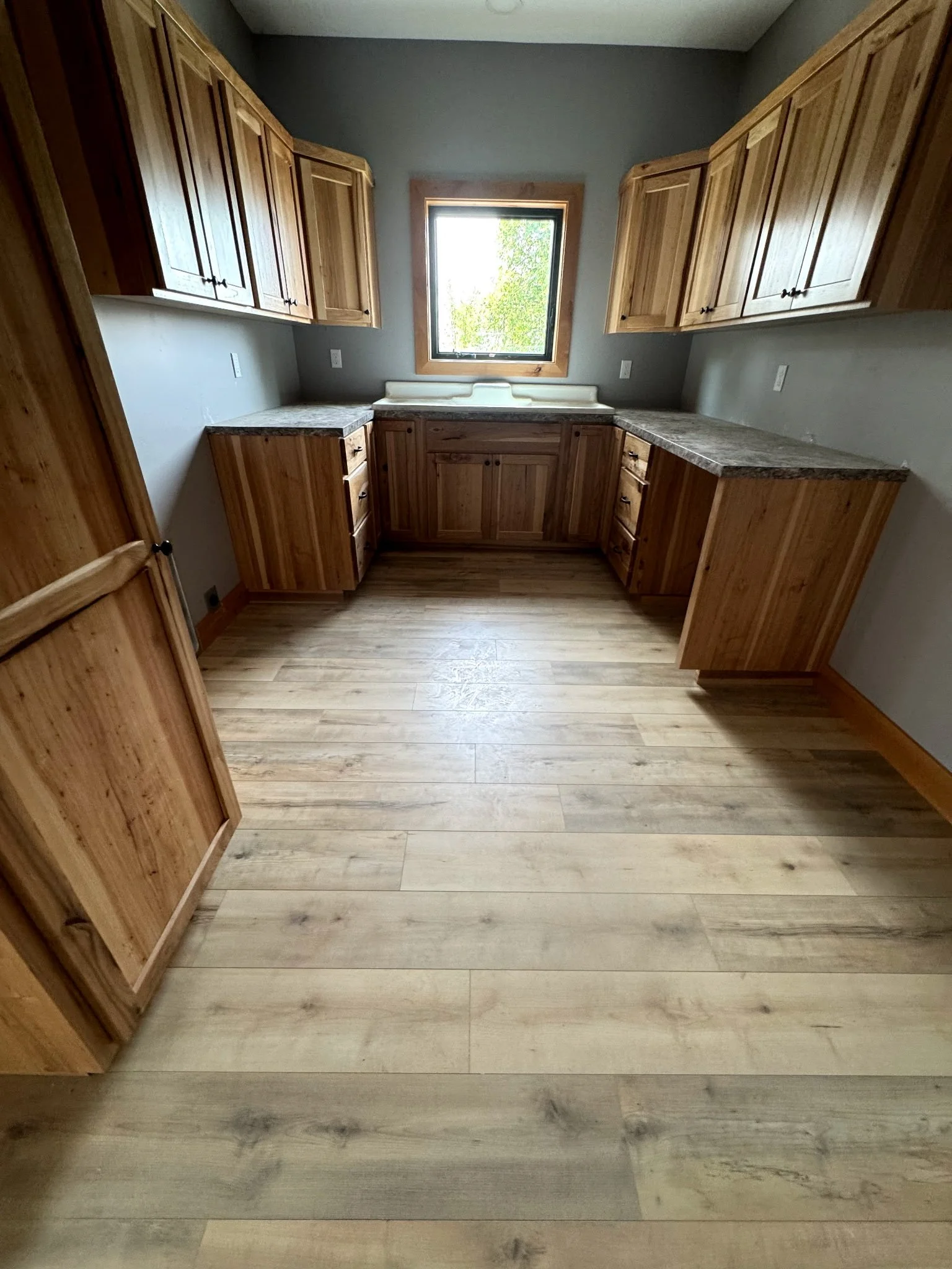 Cabinets and hardwood flooring by Northwest Home Innovations.