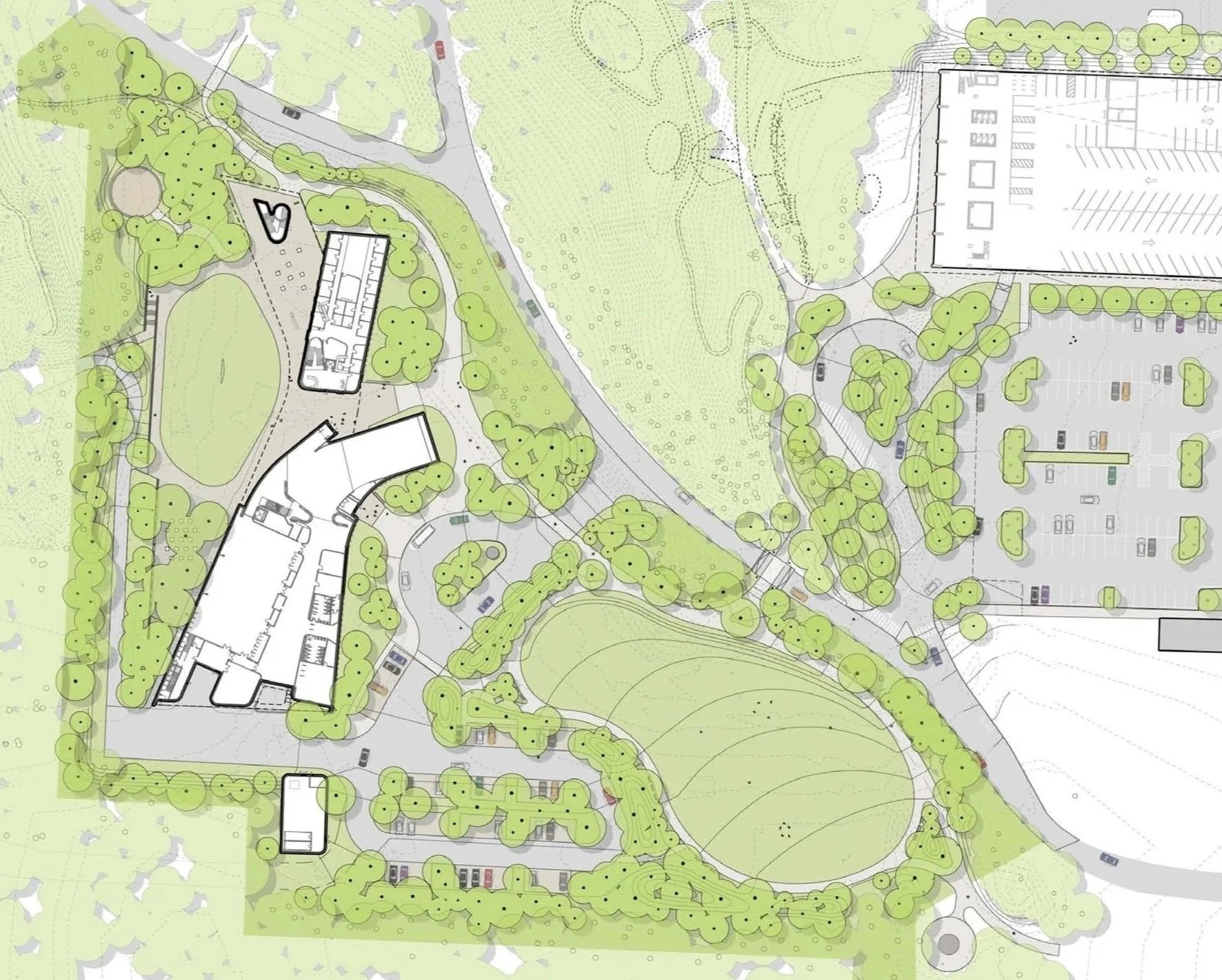 A detailed site plan map of a landscaped area including buildings, parking lots, roads, pathways, trees, and grassy areas.