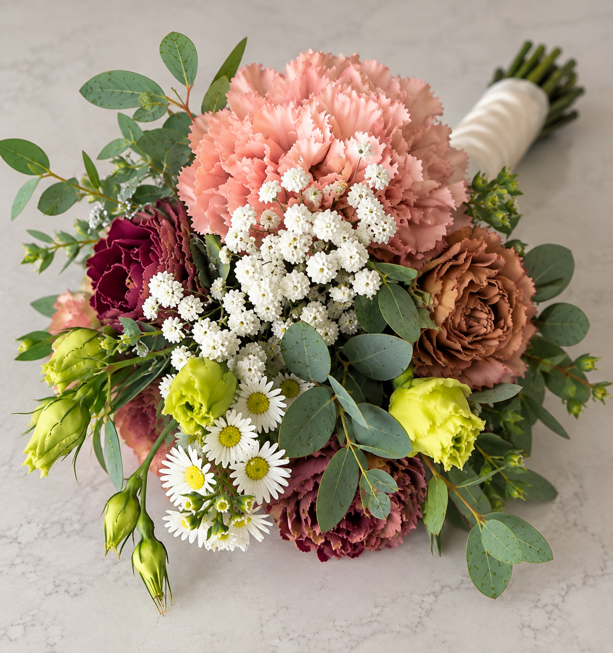 Romantic peach and blush petite Homecoming bouquet with soft floral accents by Flowers on First