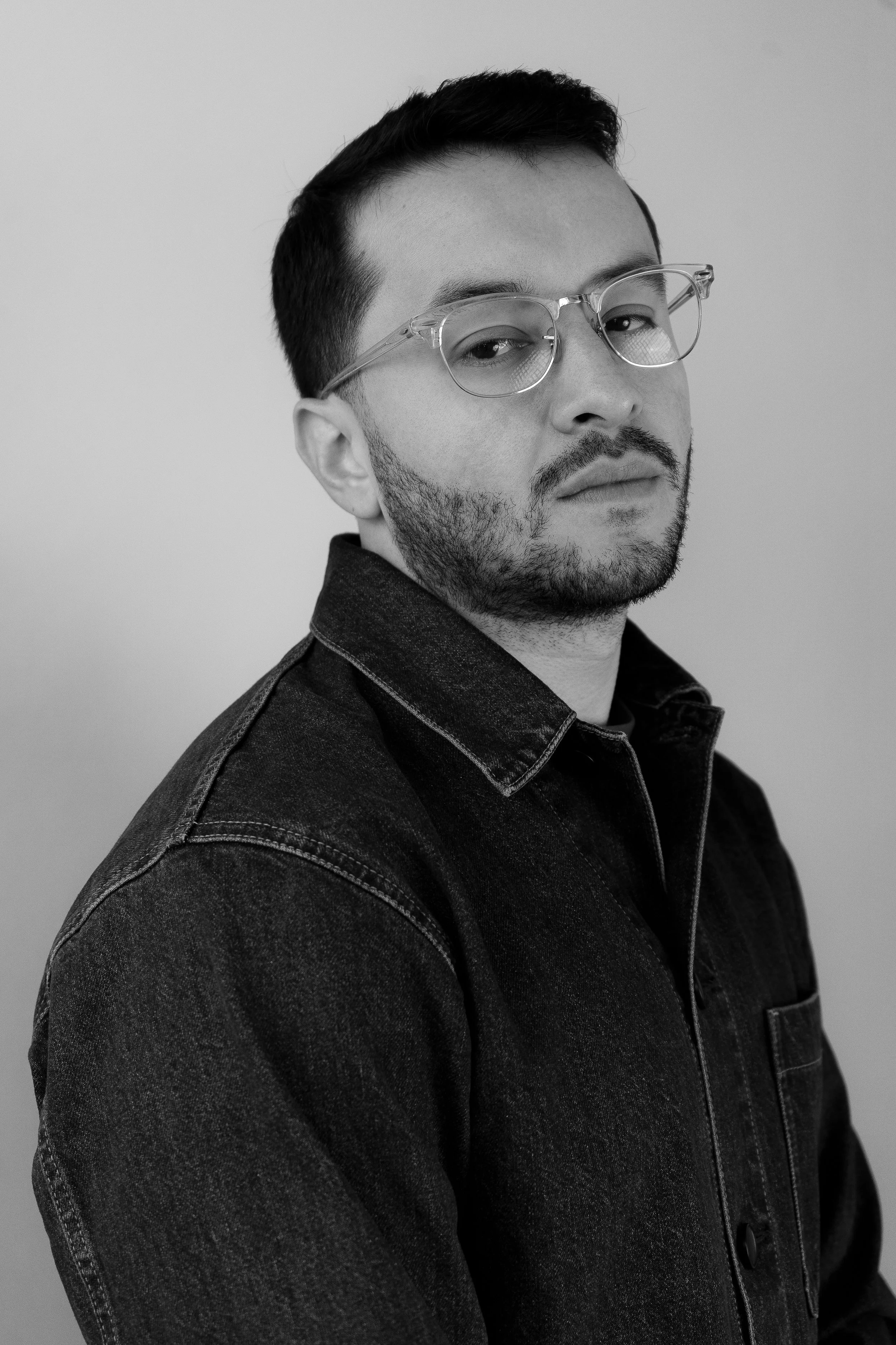 A man with glasses who is ready to deliver on any artistic endeavor and help you achieve your vision.