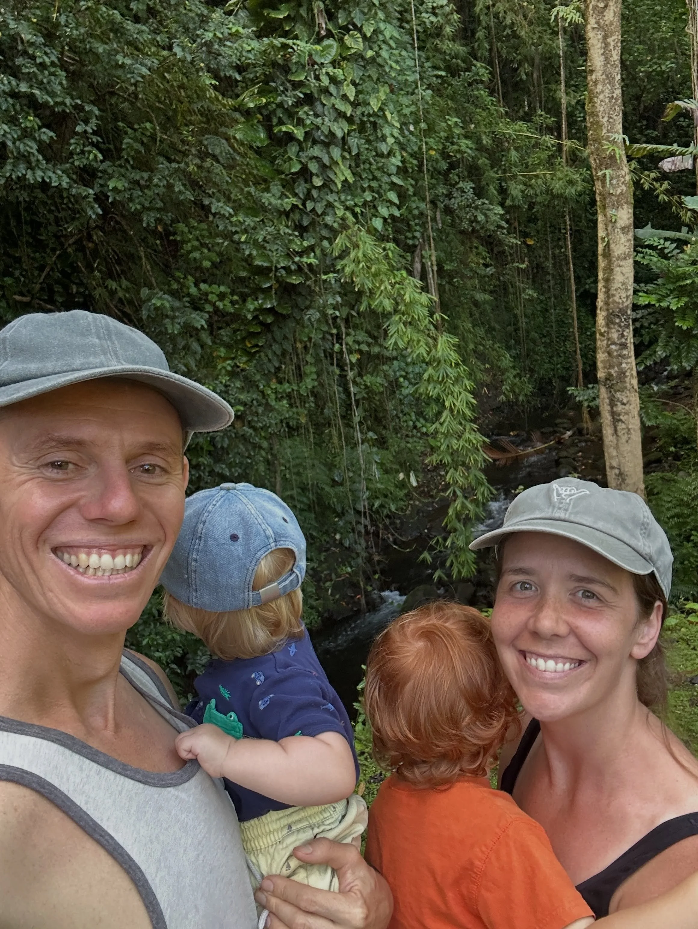 Us trying to get the boys to smile for a picture. We love our &ldquo;family walks&rdquo; past the Laupahoehoe post office down to the river. Passing the fire station on the way back the fireman invited us over to check out the fire truck. My oldest b