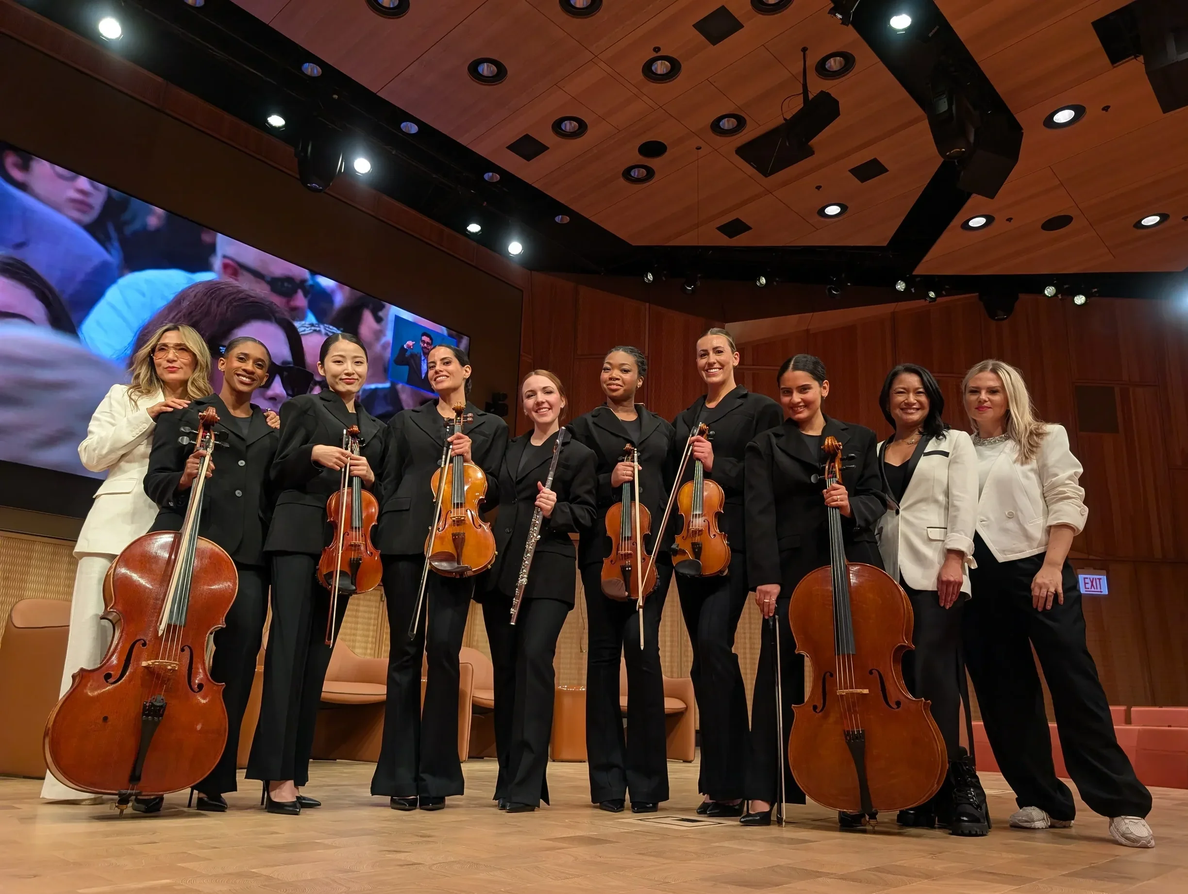 Musicians standing together at the Obama Presidential Center Opening Ceremony after performing with Christina Aguilera on "What a Wonderful World".