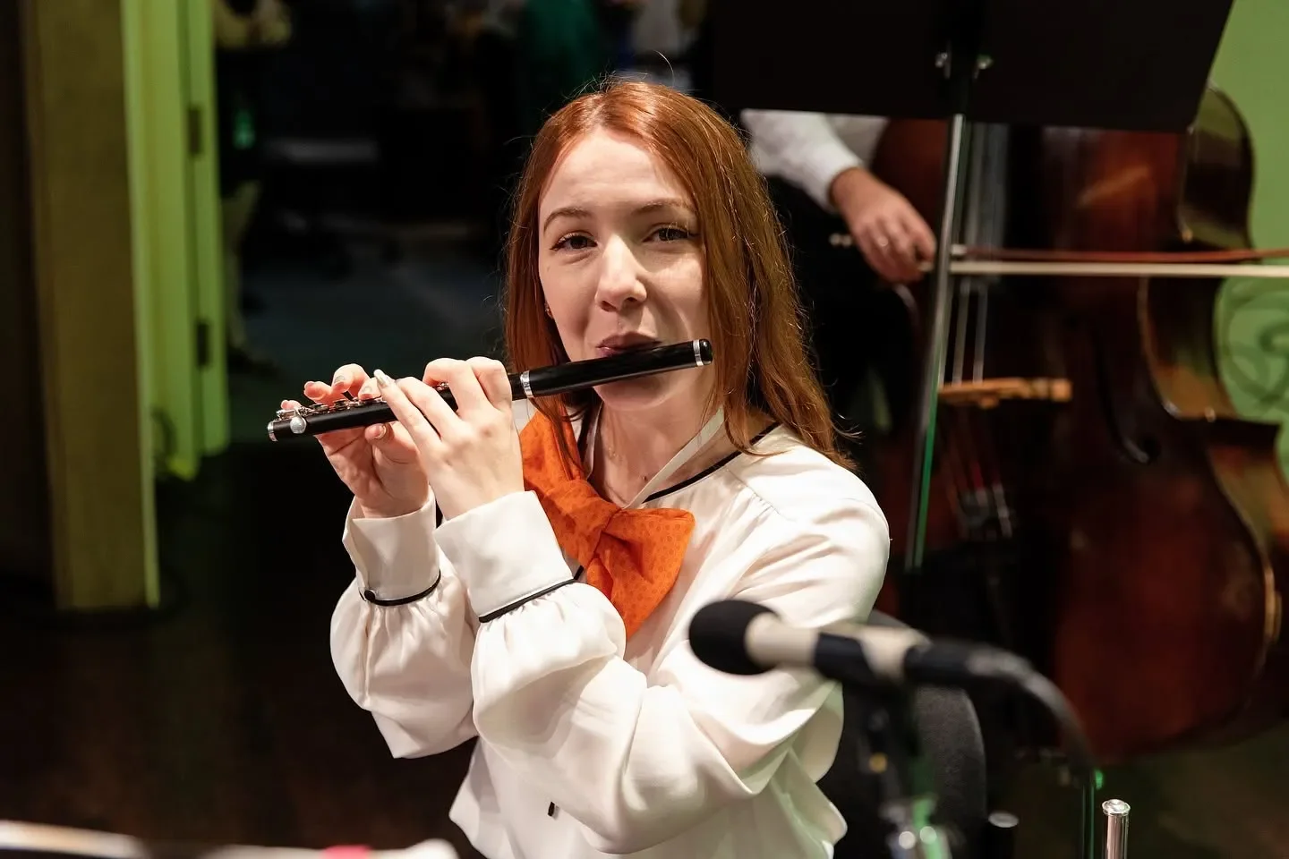 Lizzy O'Brien playing piccolo during rehearsal for "Dr. Seuss Goes to the Opera" with JAM Orchestra at Martin Theater, Ravinia Festival.