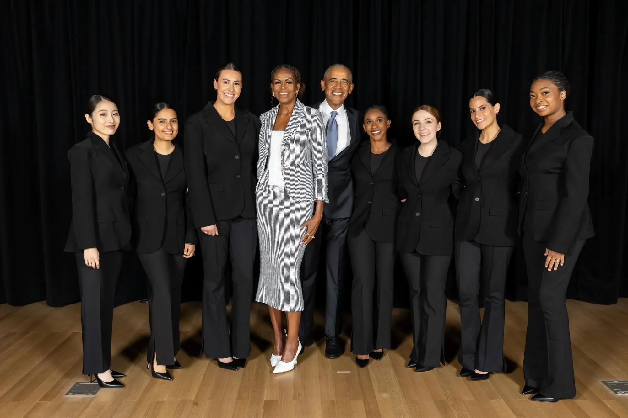 Lizzy O'Brien and featured musicians standing with Barack and Michelle Obama at the Grand Opening Ceremony of the Obama Presidential Center.