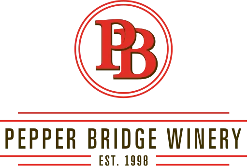Logo of Pepper Bridge Winery with red 'PB' initials inside a circle.