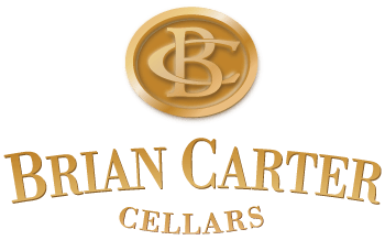 Gold coin with initials BC, and text 'BRIAN CARTER CELLARS' below.