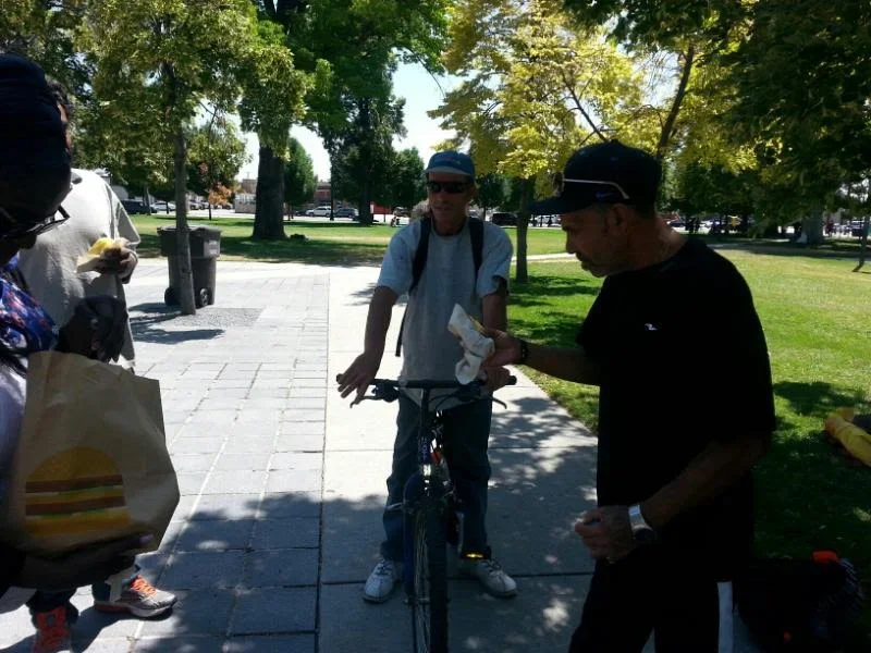 Handing out sandwiches to the homeless