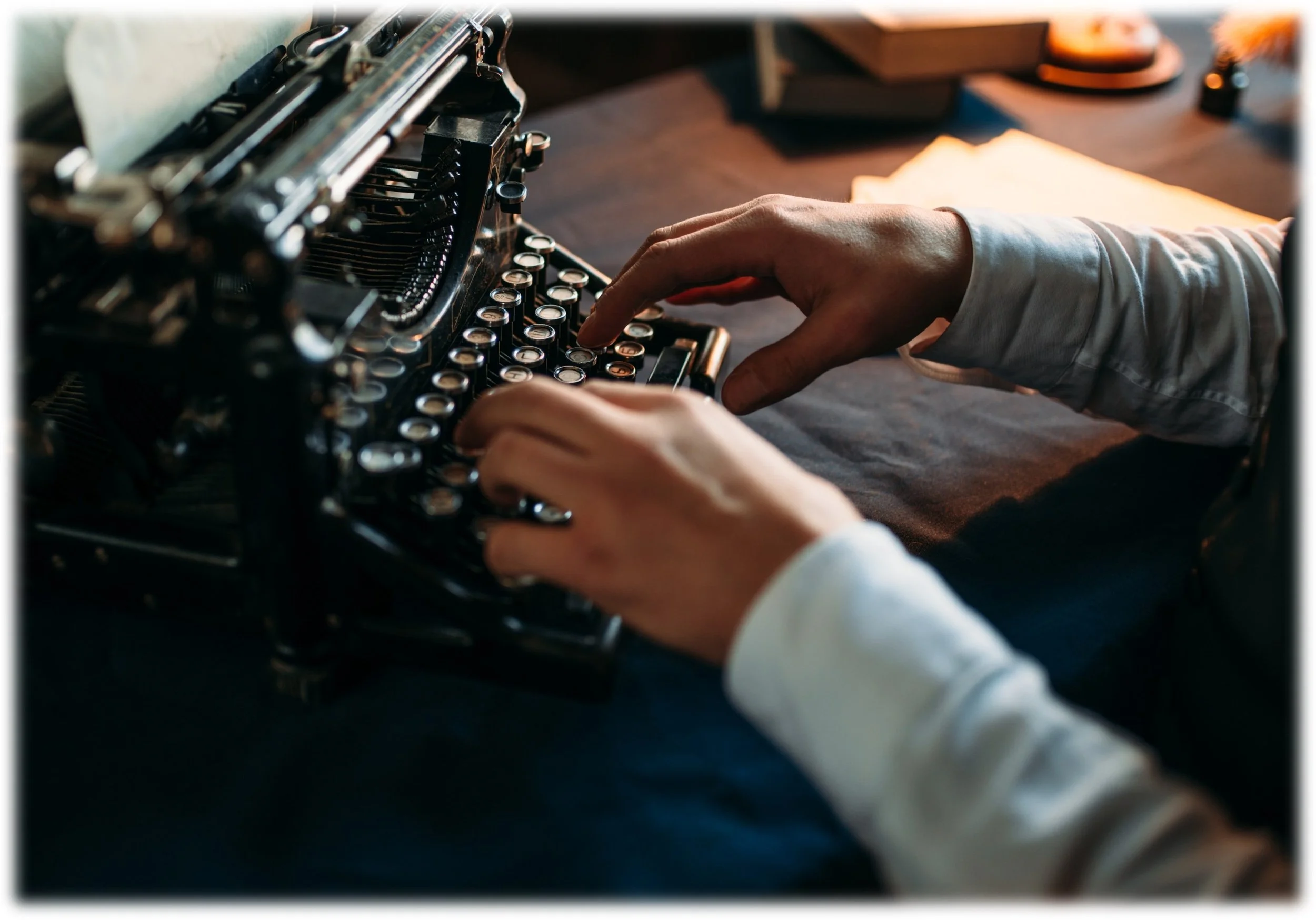stock photo of hands typing on an old-fashioned typewriter