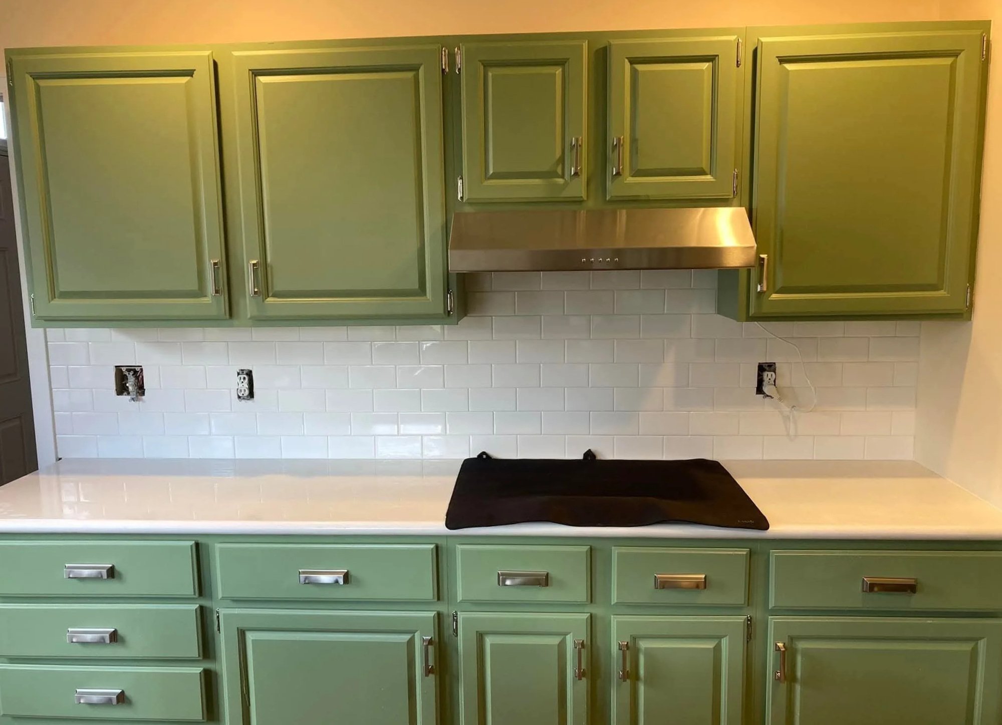 White subway tiles with green cabinets create a timeless kitchen backsplash and bathroom design using ceramic or porcelain subway tile. Perfect for kitchen renovation, bathroom remodel, modern farmhouse, and interior design projects.