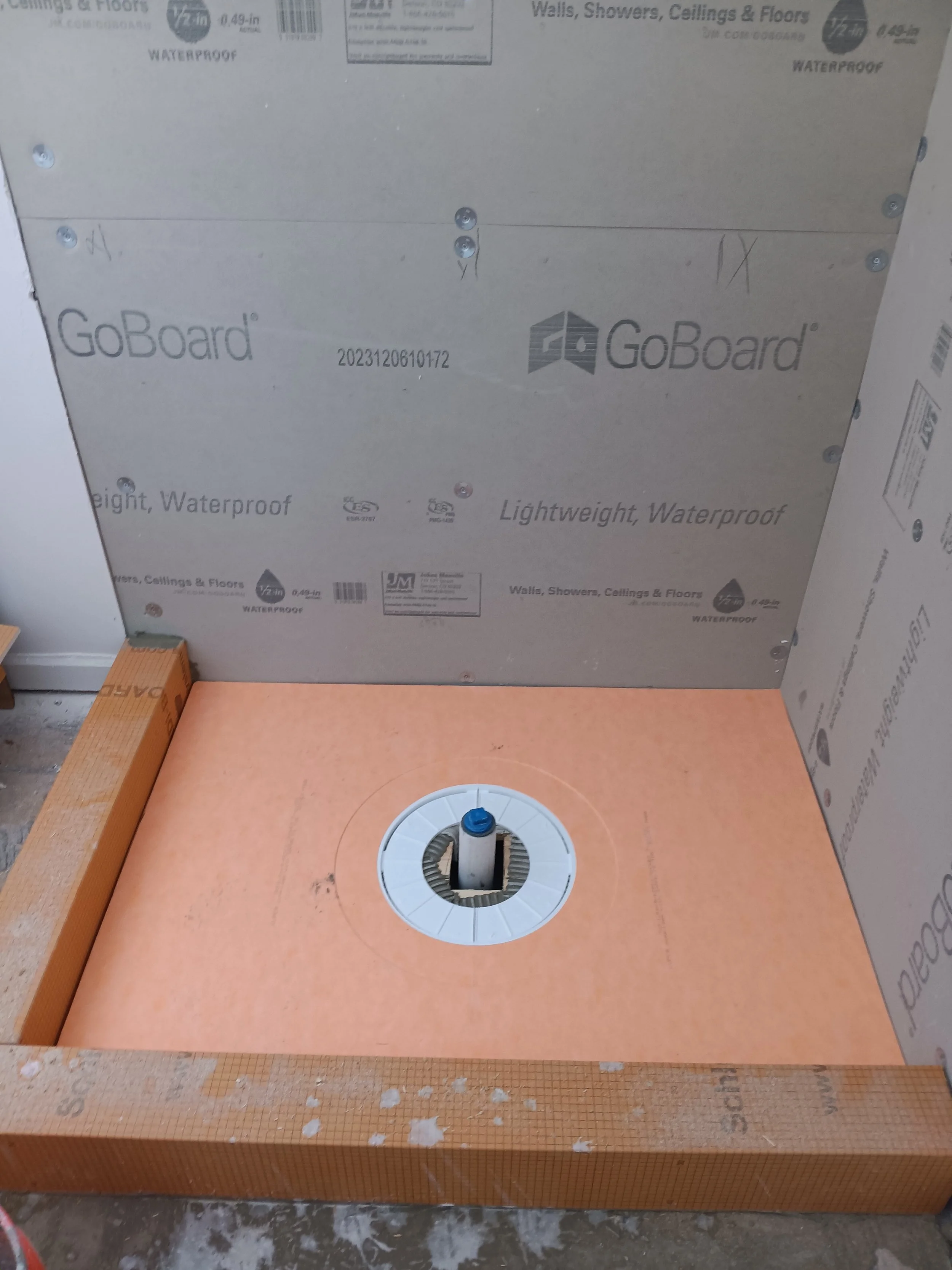 Schluter shower pan installation before tile, featuring a waterproof, pre-sloped system for proper drainage. Ideal for bathroom remodels and custom tile shower construction.