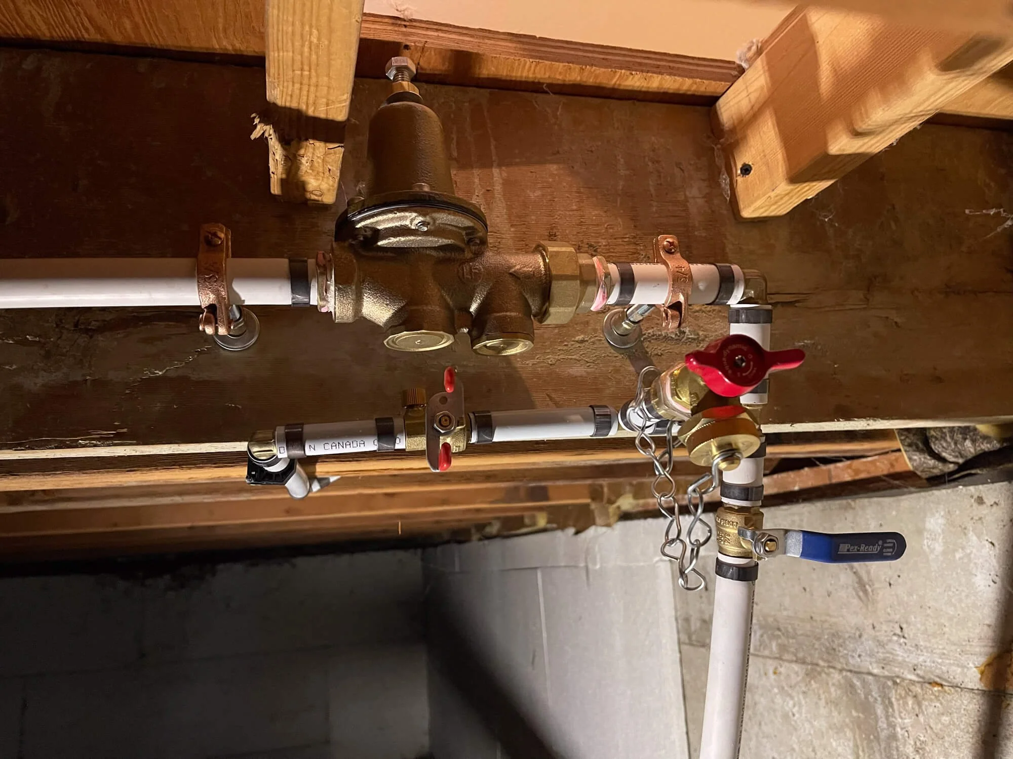 Residential water pressure monitoring system with a professional-grade pressure gauge and shut-off valve.