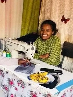 Lidiya at sewing machine