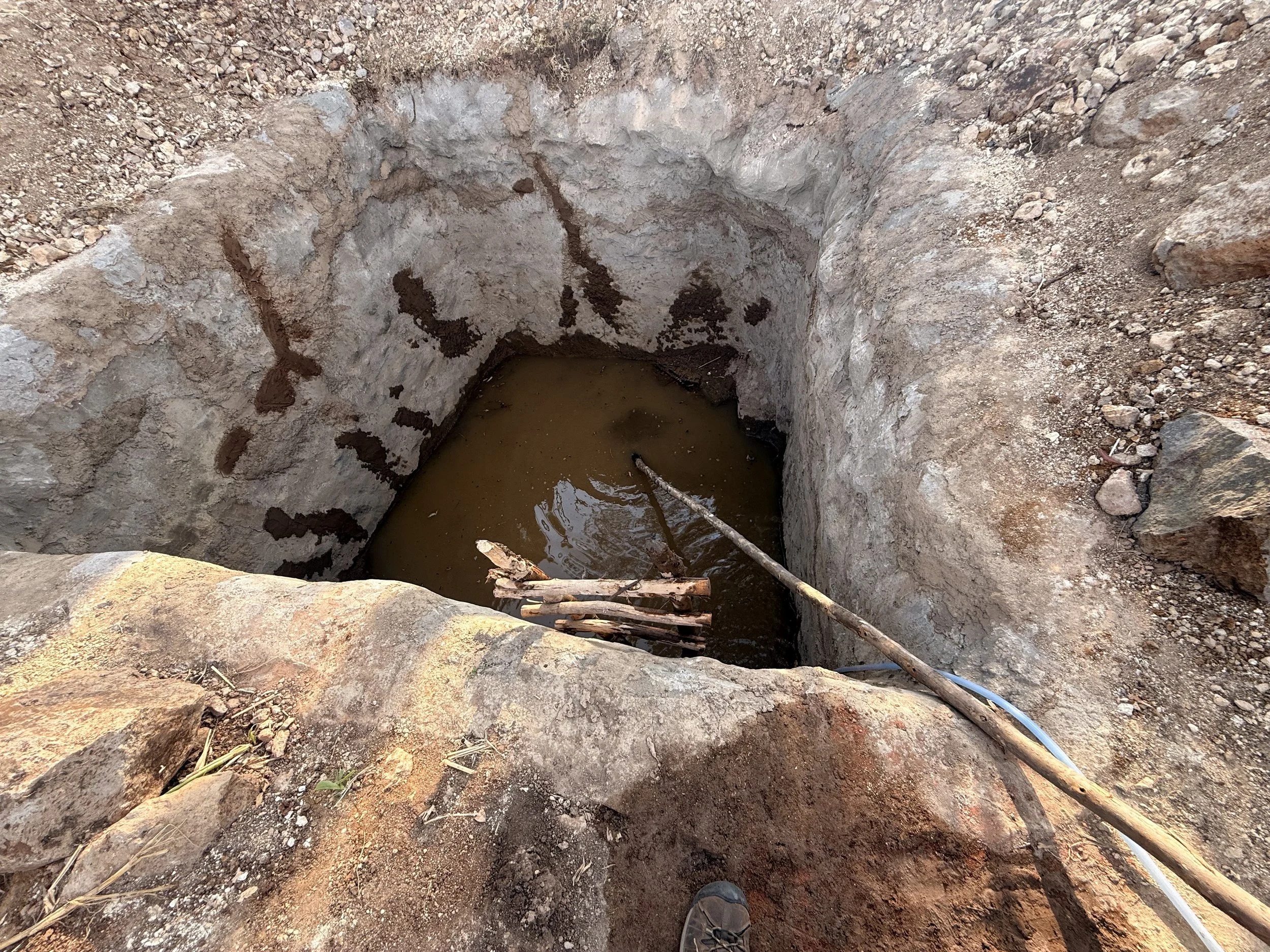 Water hole for concrete mixing in Kora Bela