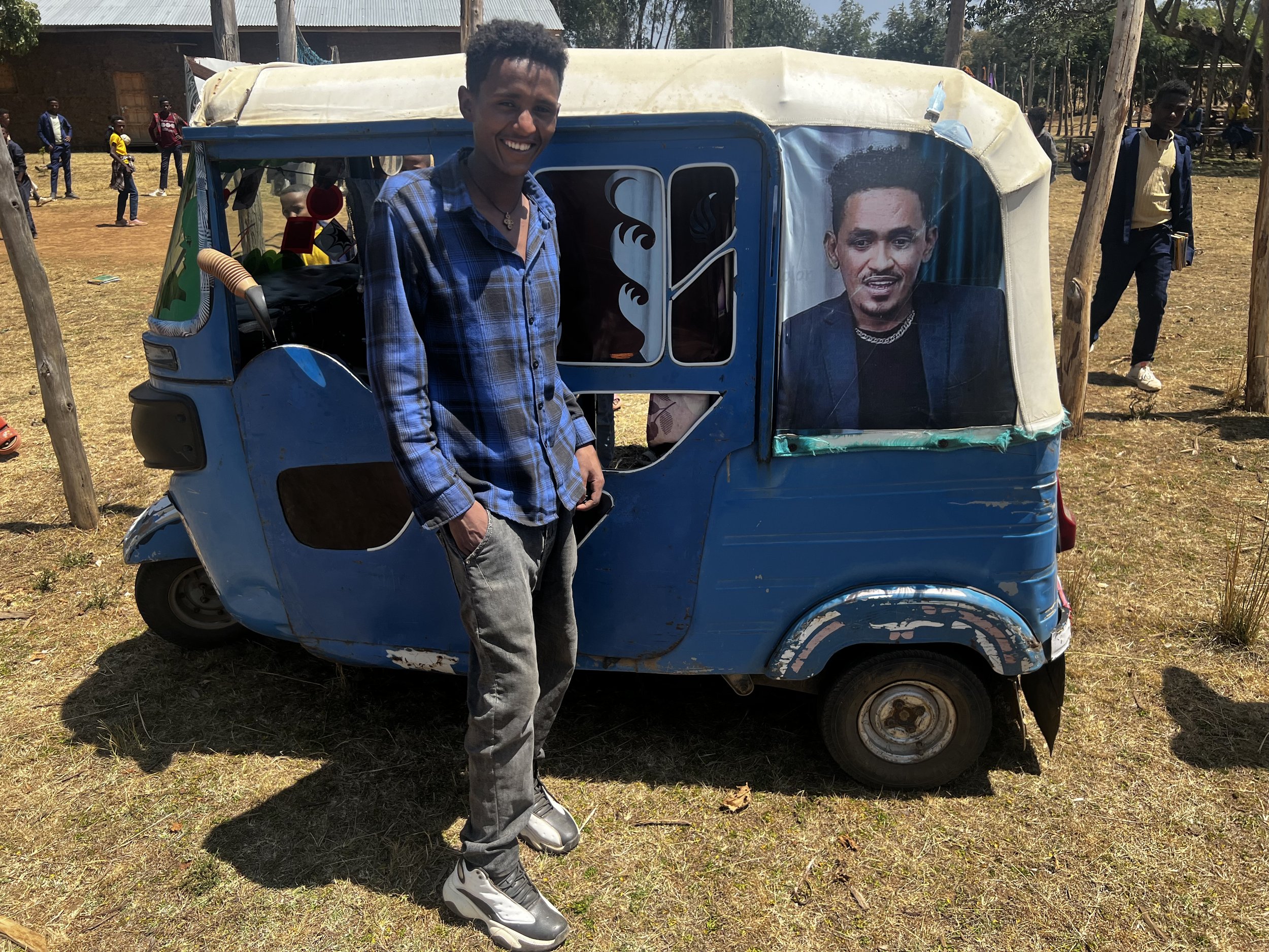 Na'Ol in later years with his bajaj during school visit