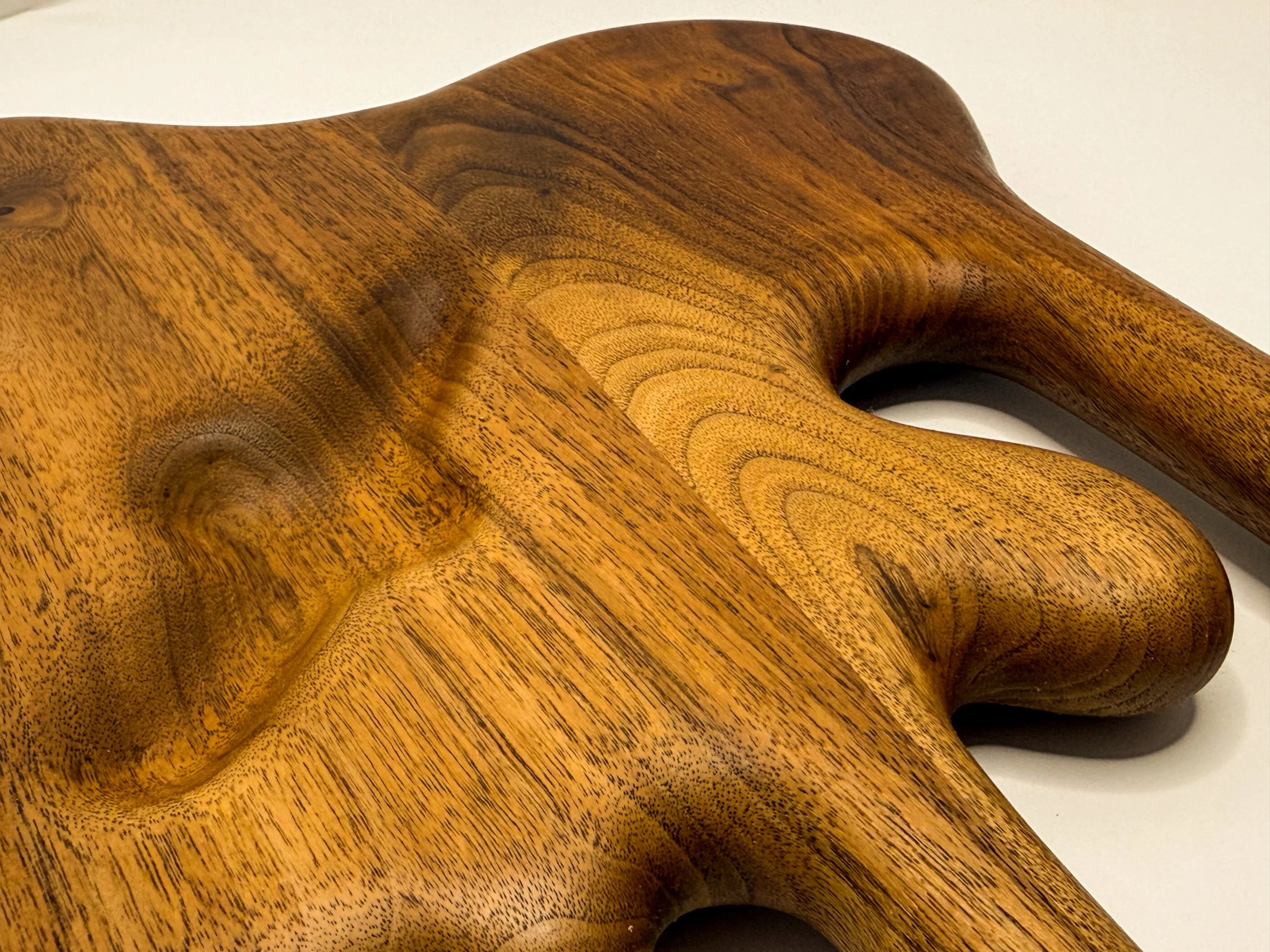 Detail view of sculptural walnut magnetic knife block titled Drip by Smoke & Ember Studios