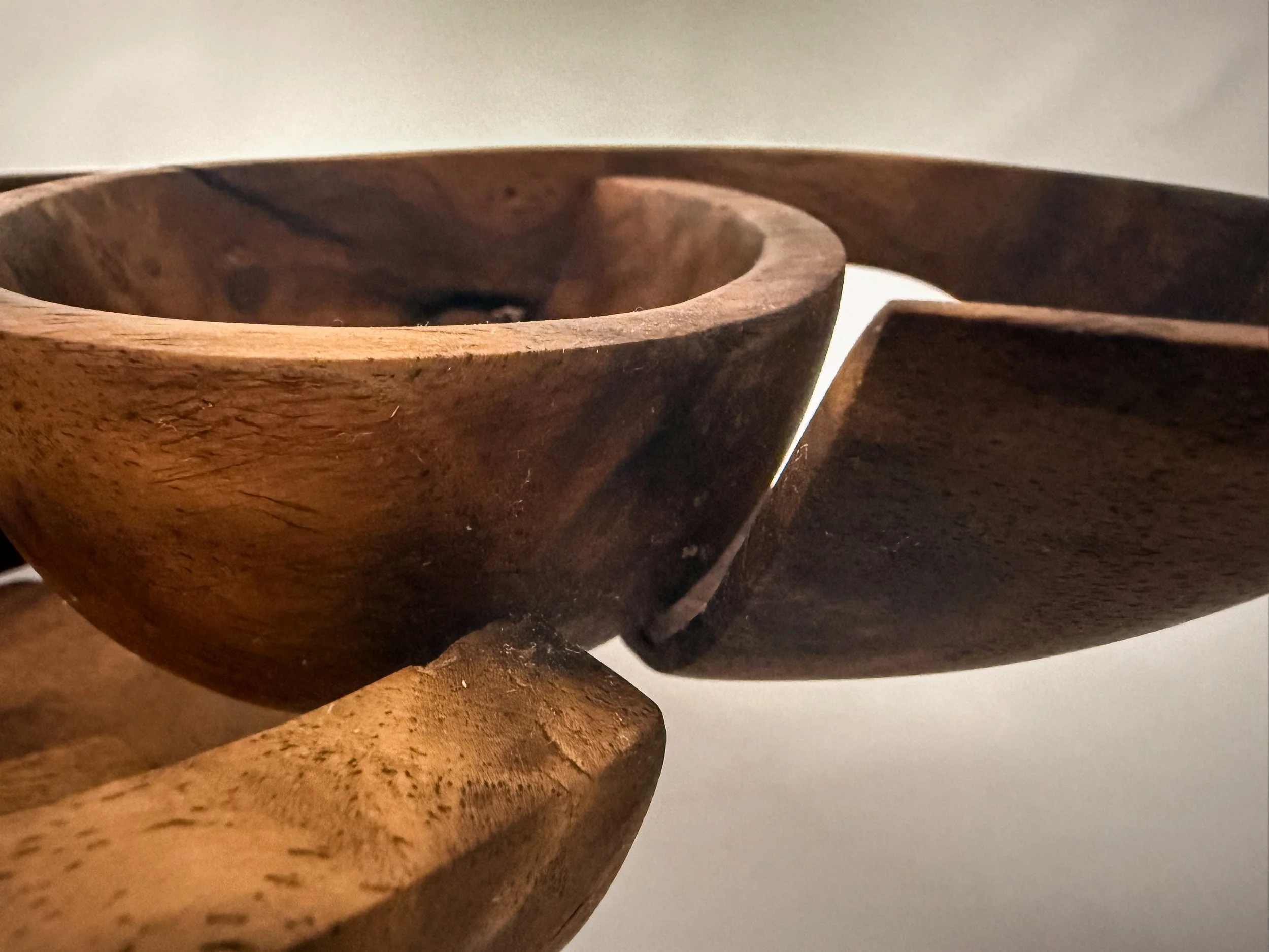 Detail view of hand-carved walnut sculptural bowl titled Taper