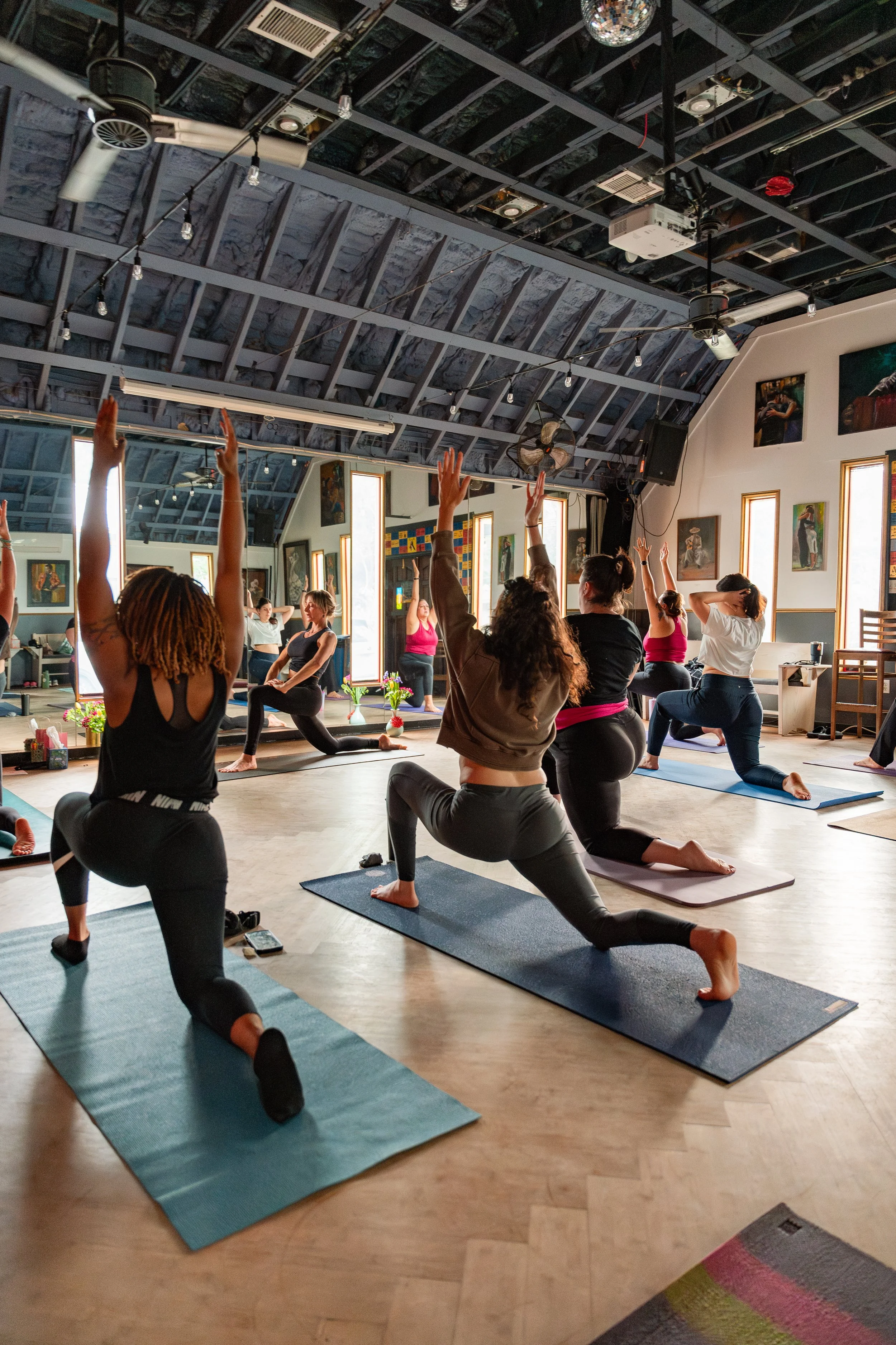 Women working out at mama wears pants' Spring Reset Class.