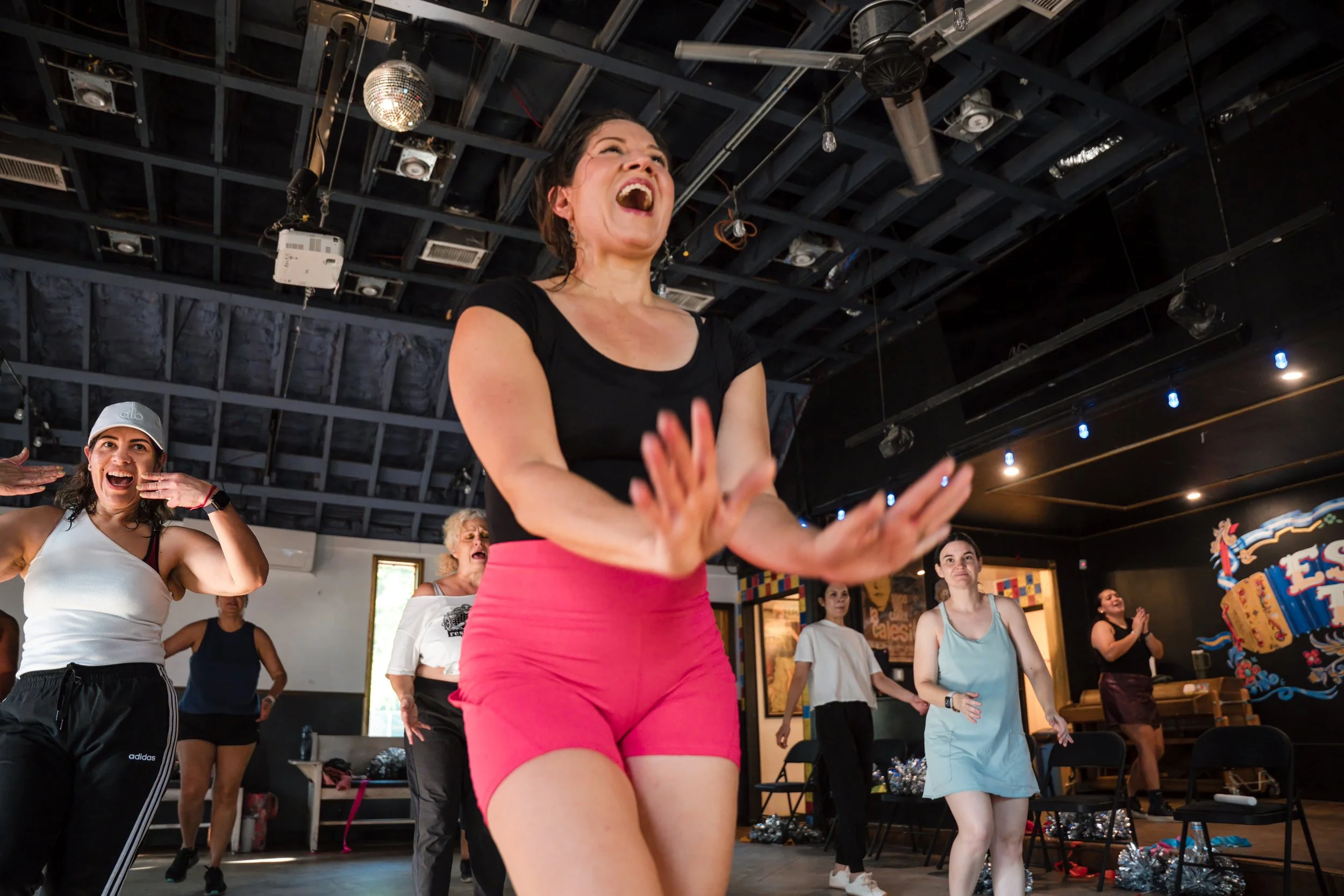women enjoying Mama's Dance Party fitness dance event.