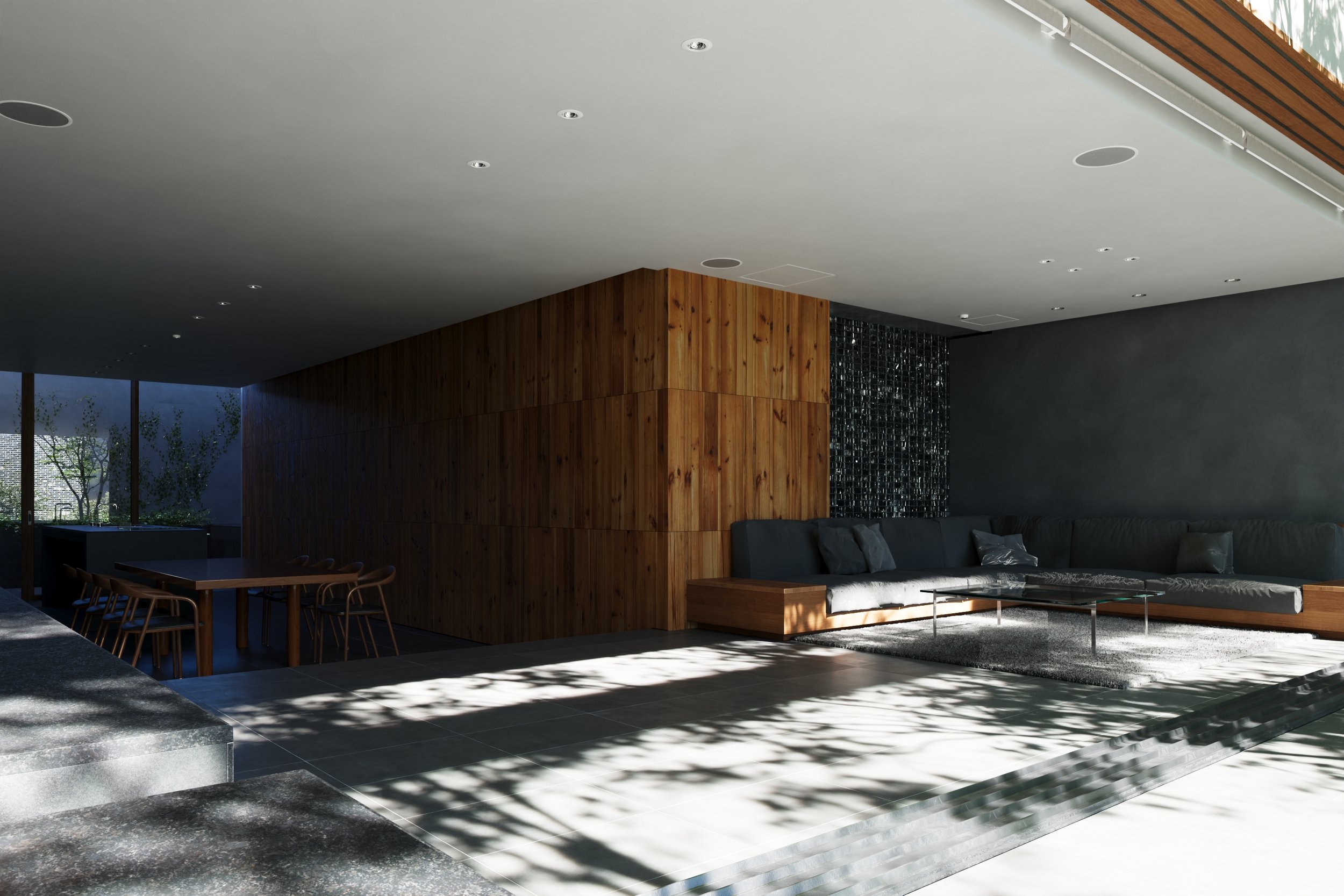 A modern living room with a sectional sofa, a wooden accent wall, and large windows. Shadows from nearby trees cast patterns on the floor.