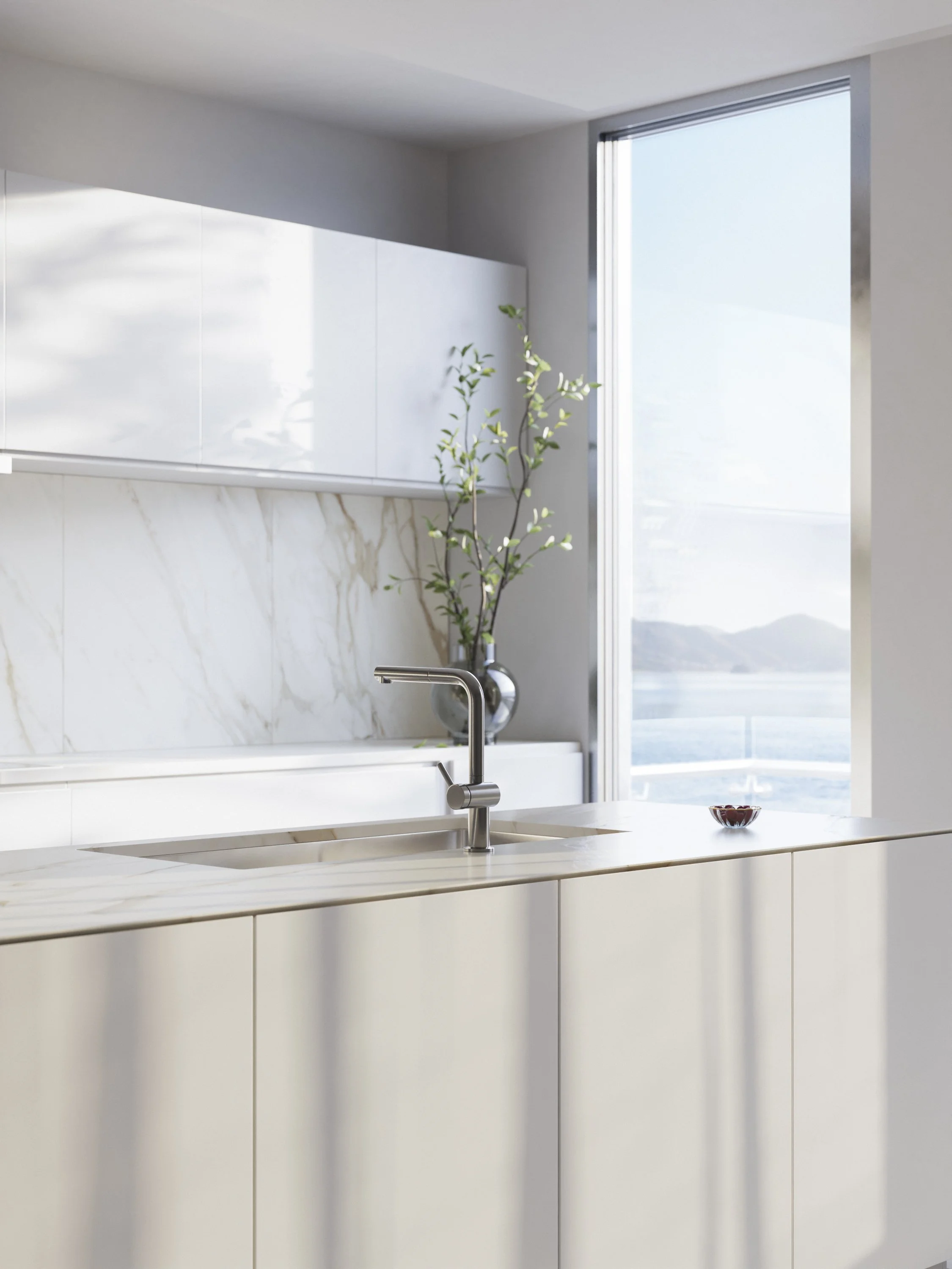 Modern kitchen with a marble countertop, stainless steel sink and faucet, white cabinets, a potted plant, and a large window showing an outdoor view.