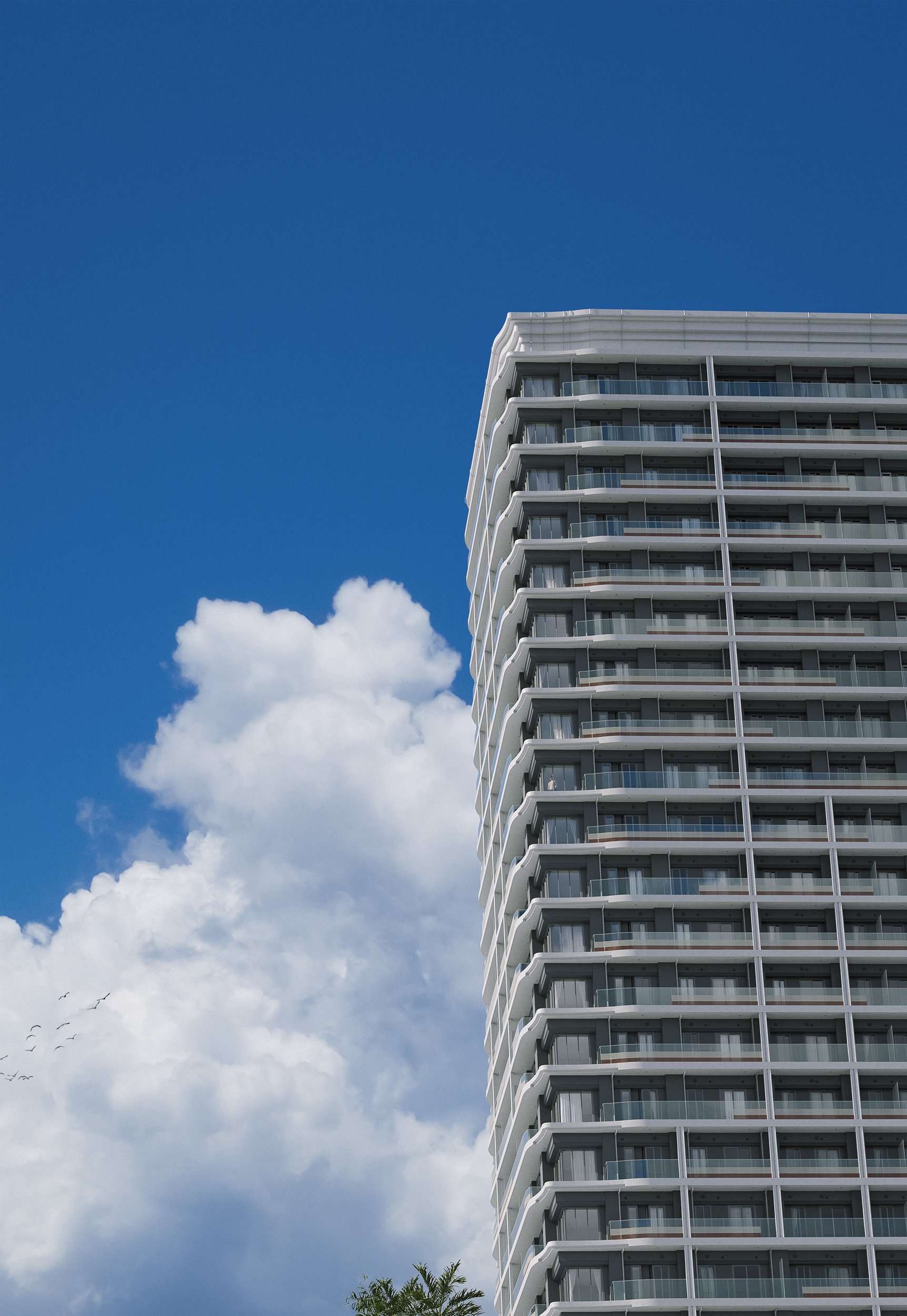 A tall modern apartment building with multiple balconies against a bright blue sky with clouds.