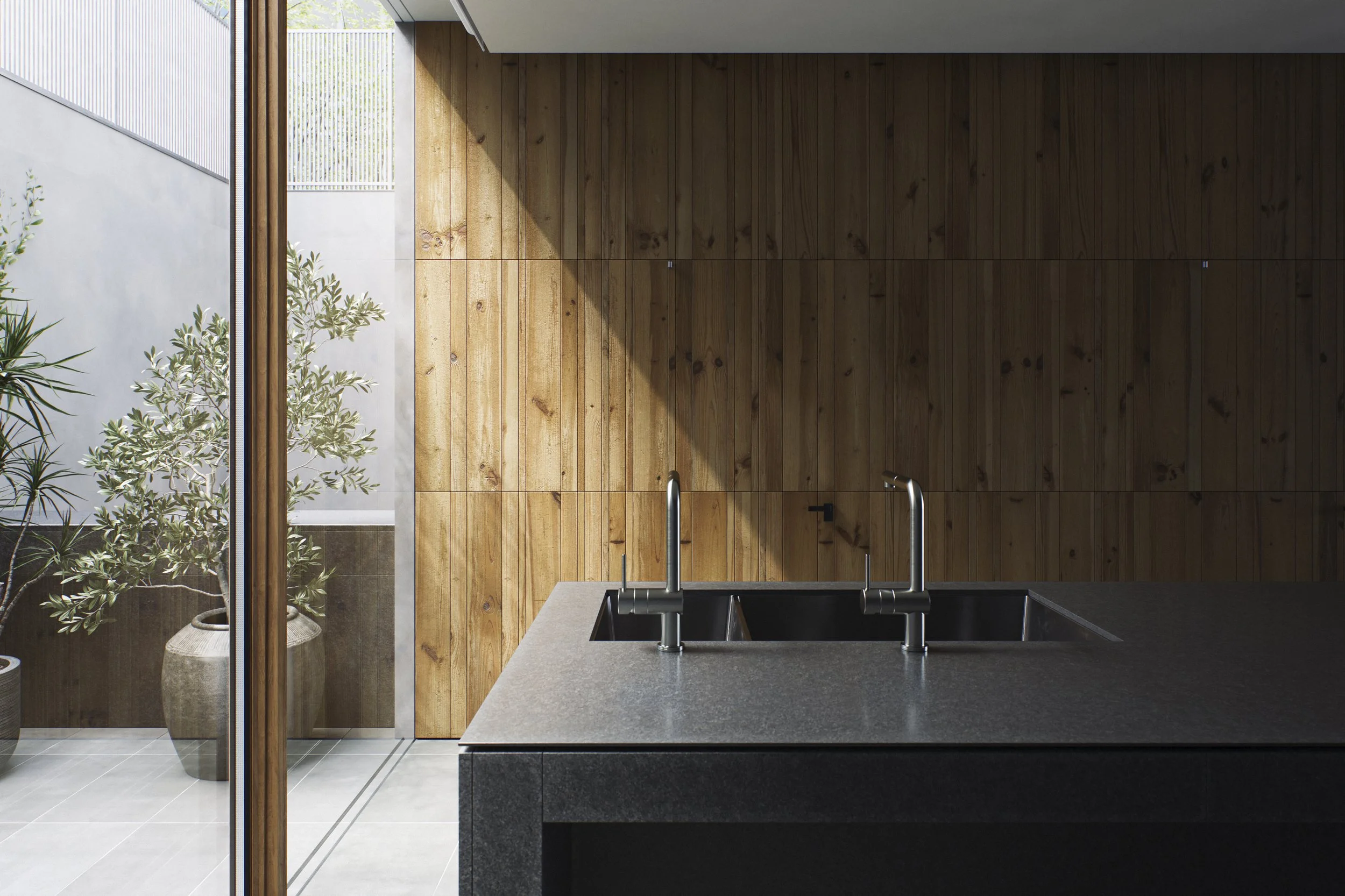 Modern kitchen with black countertop, double sink with chrome faucets, wooden wall paneling, floor-to-ceiling glass door leading outside, and potted plants.