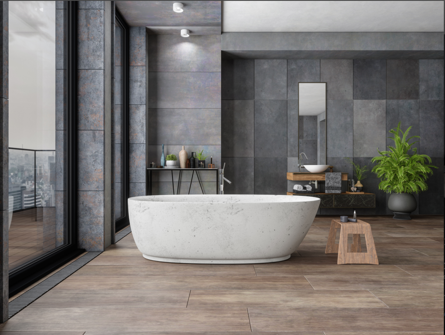 Modern bathroom with large white freestanding bathtub, wooden bench, black metal shelf with decorative items, grey tiled walls, large windows, and potted plants.