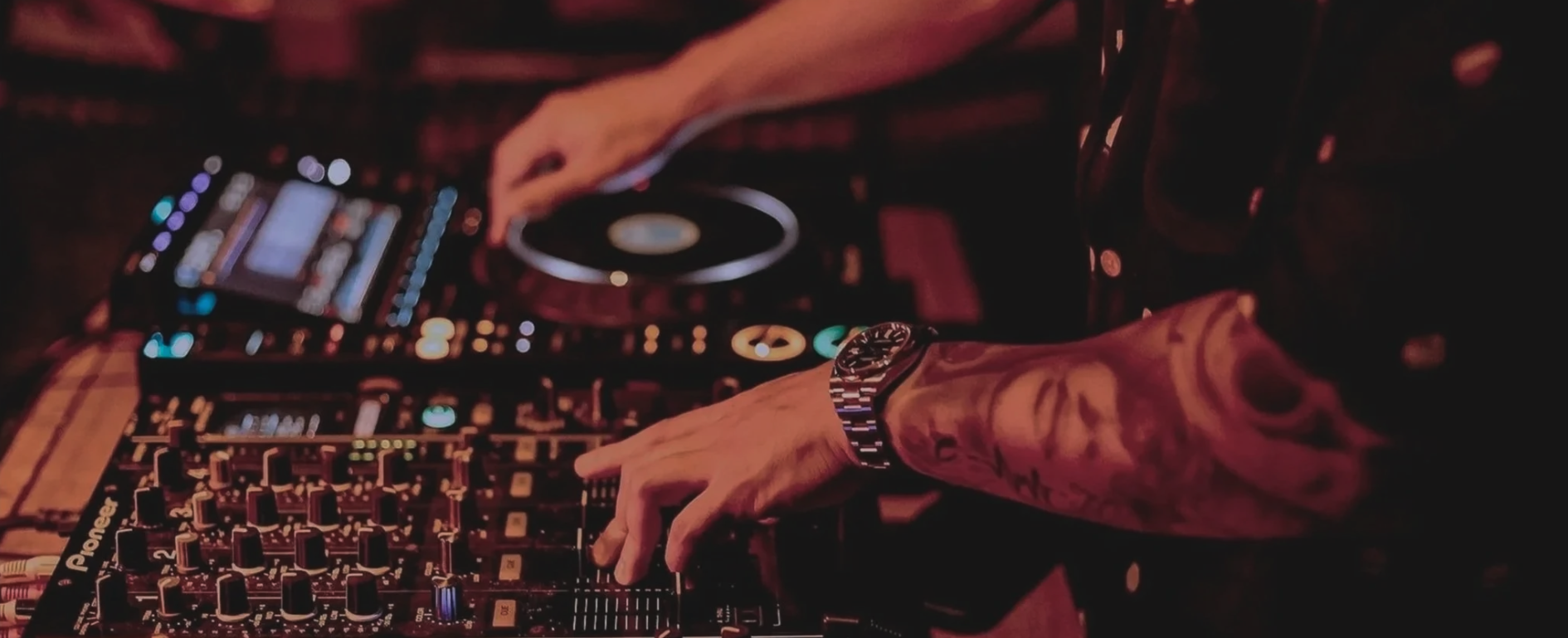 DJ table playing at AVA Lounge in a vibrant setting.