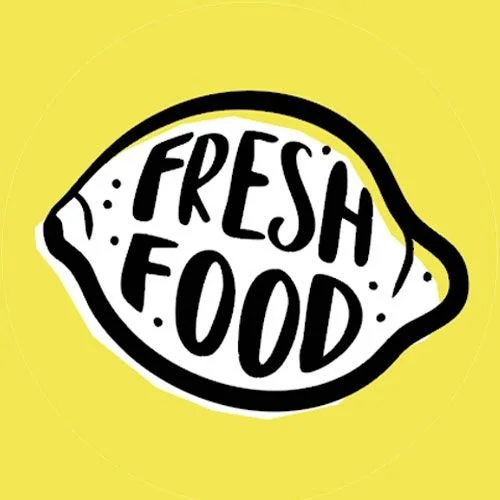 A lemon-shaped sign with the words 'FRESH FOOD' written inside, yellow background.