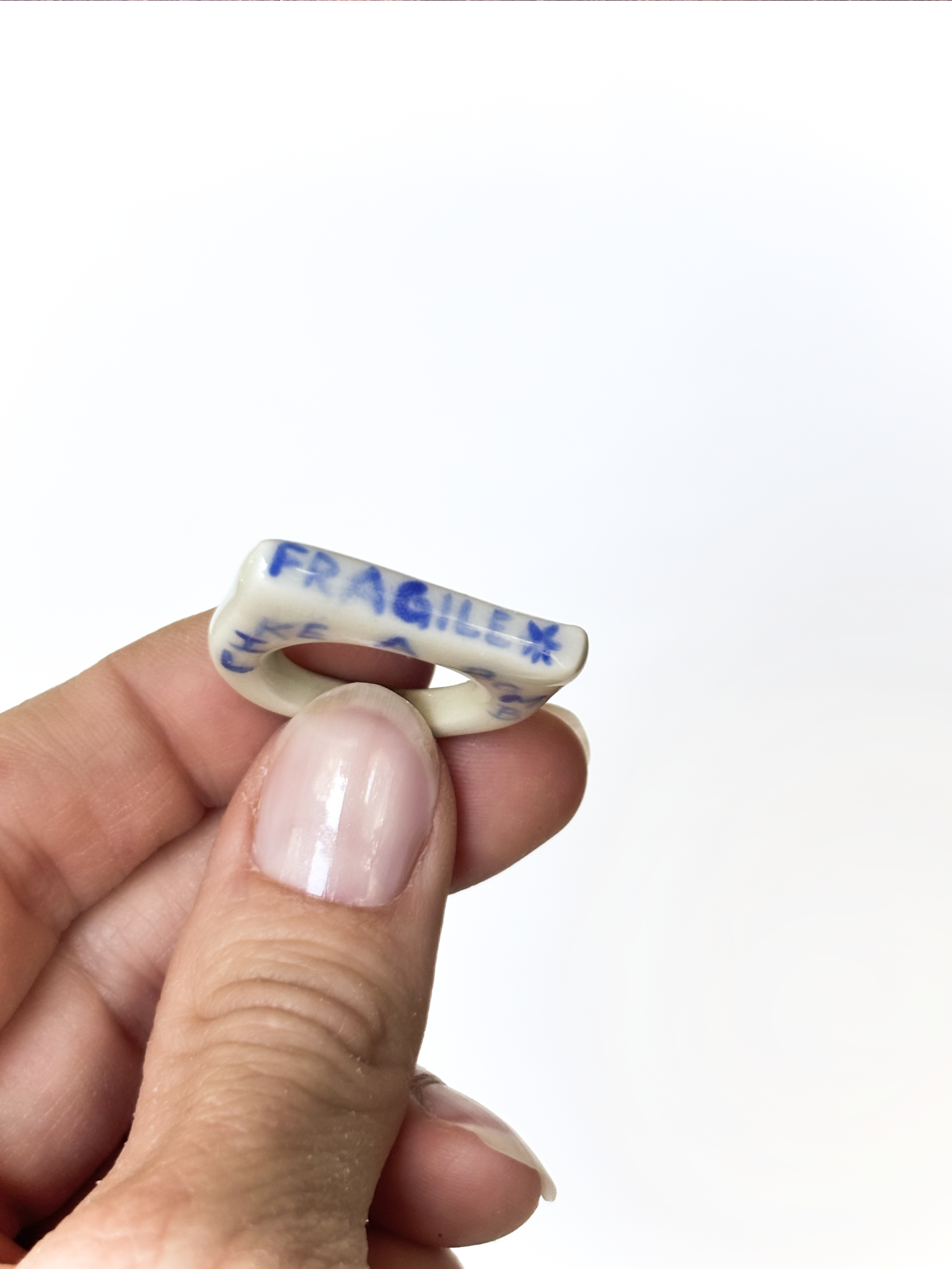 Not Okay Club-tip-floral-porcelain-ring-swear-word-jewelry-fragile-like-a-bomb-ceramic.png